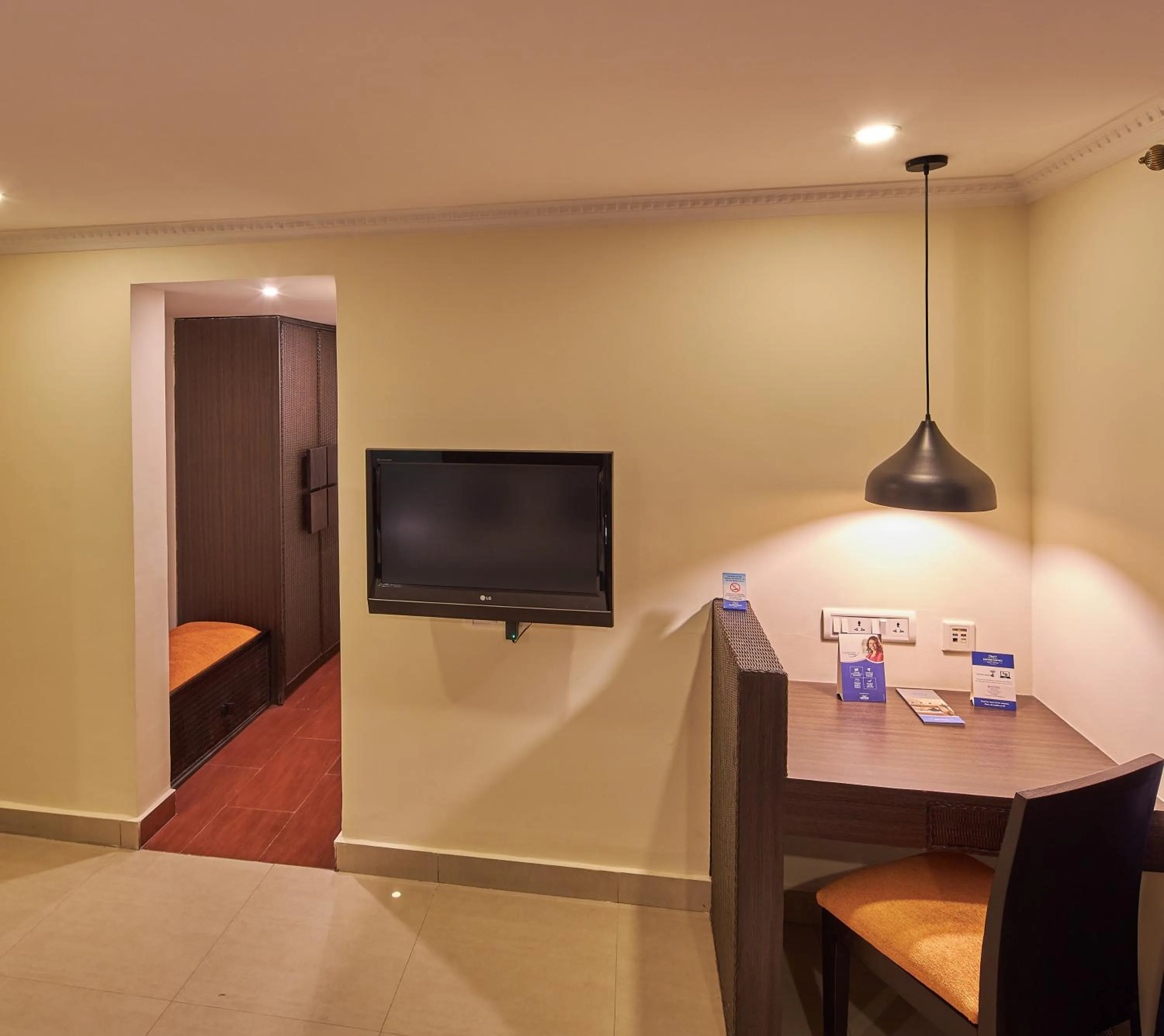 Seating area, Bed in Tulip Inn Koramangala Bangalore