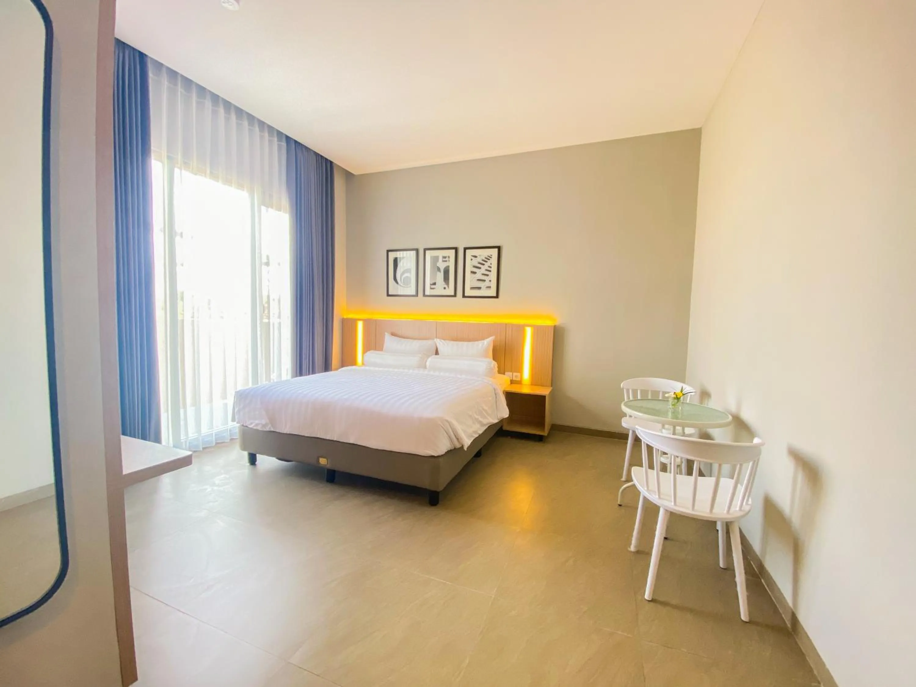 Property building, Bed in Front One King Hotel Tuban