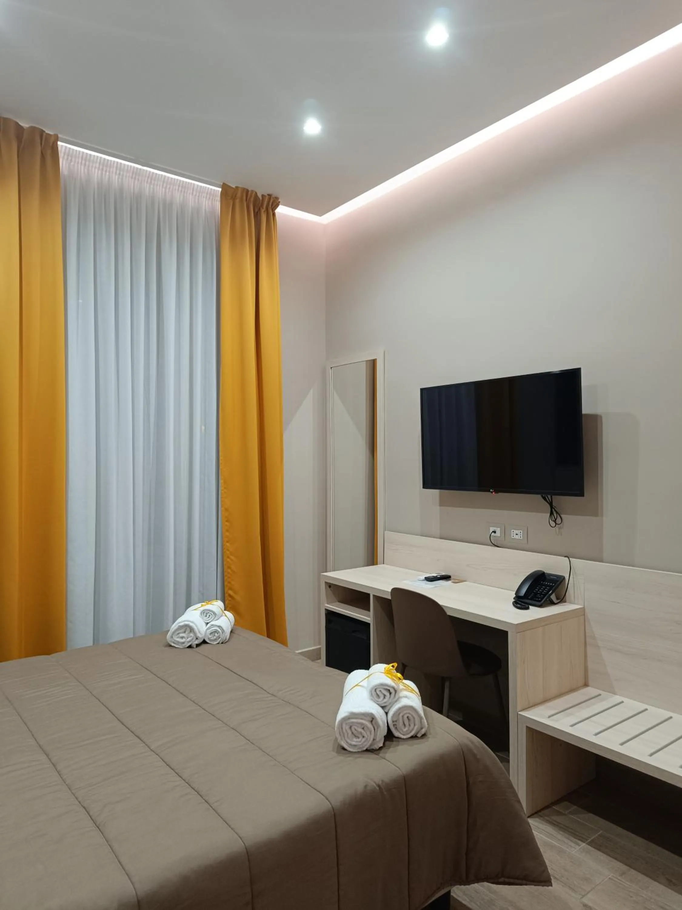 TV and multimedia, Bed in Schilizzi Hotel