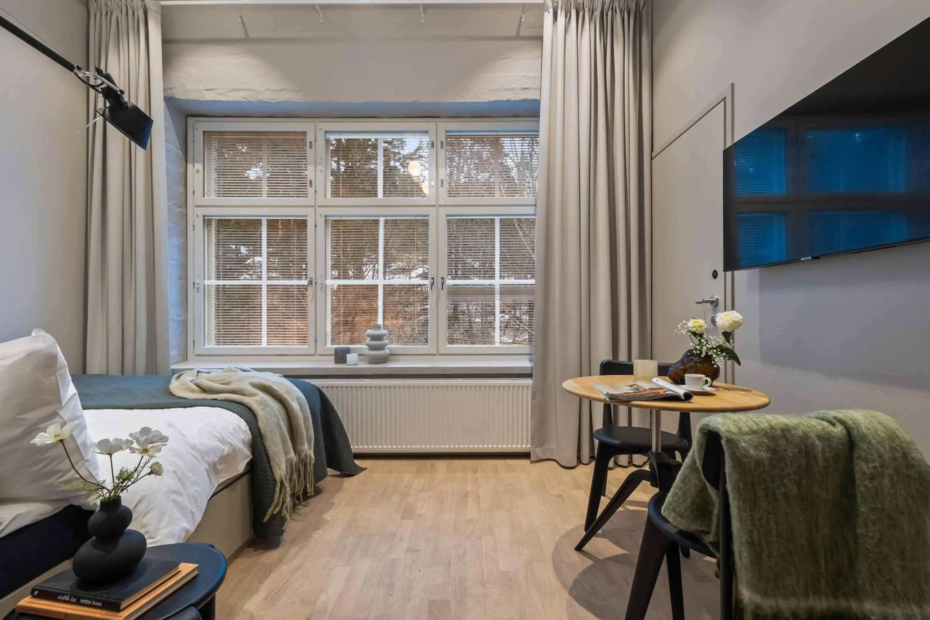 Living room, Bed in Unity Tampere - A Studio Hotel