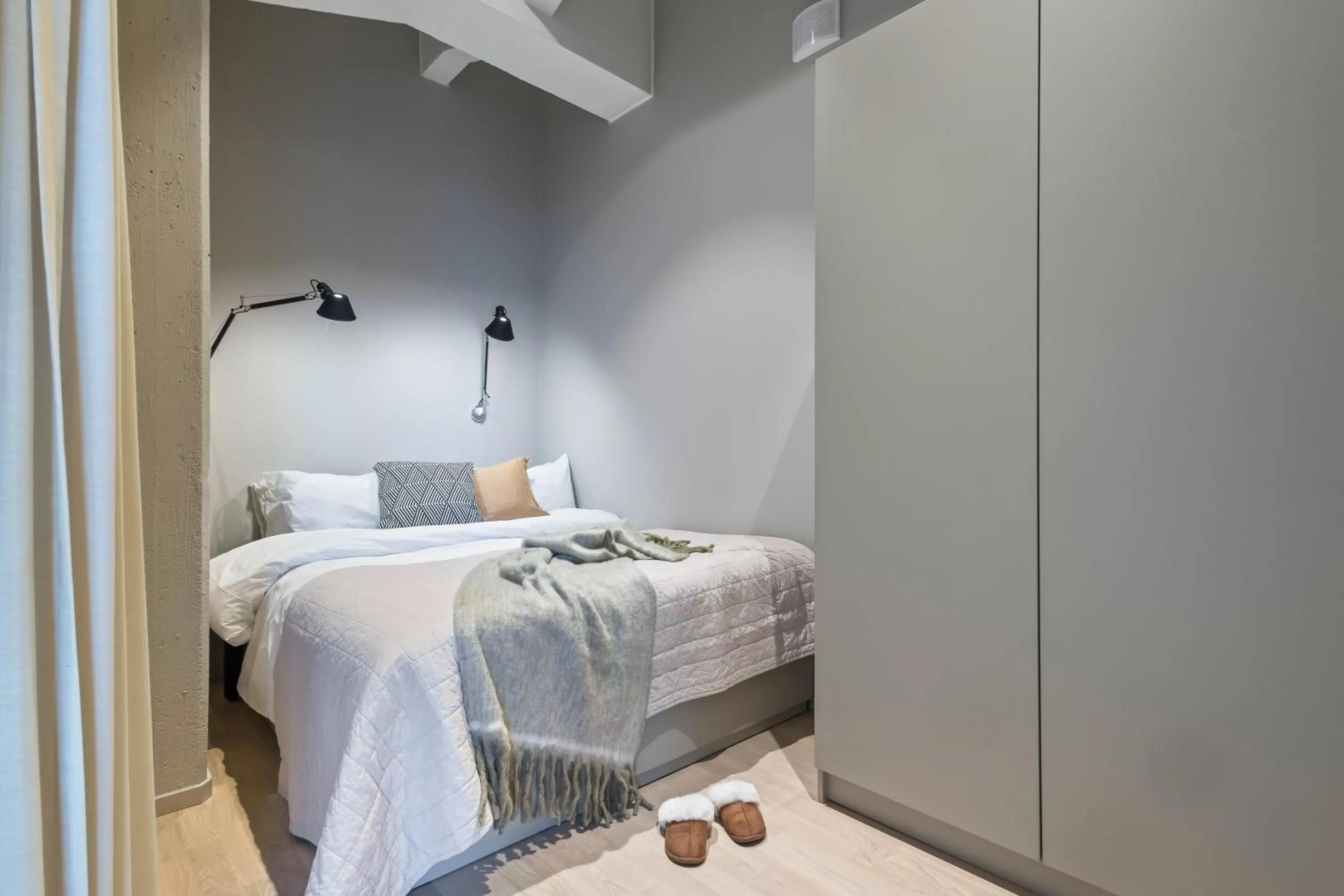 Bed in Unity Tampere - A Studio Hotel