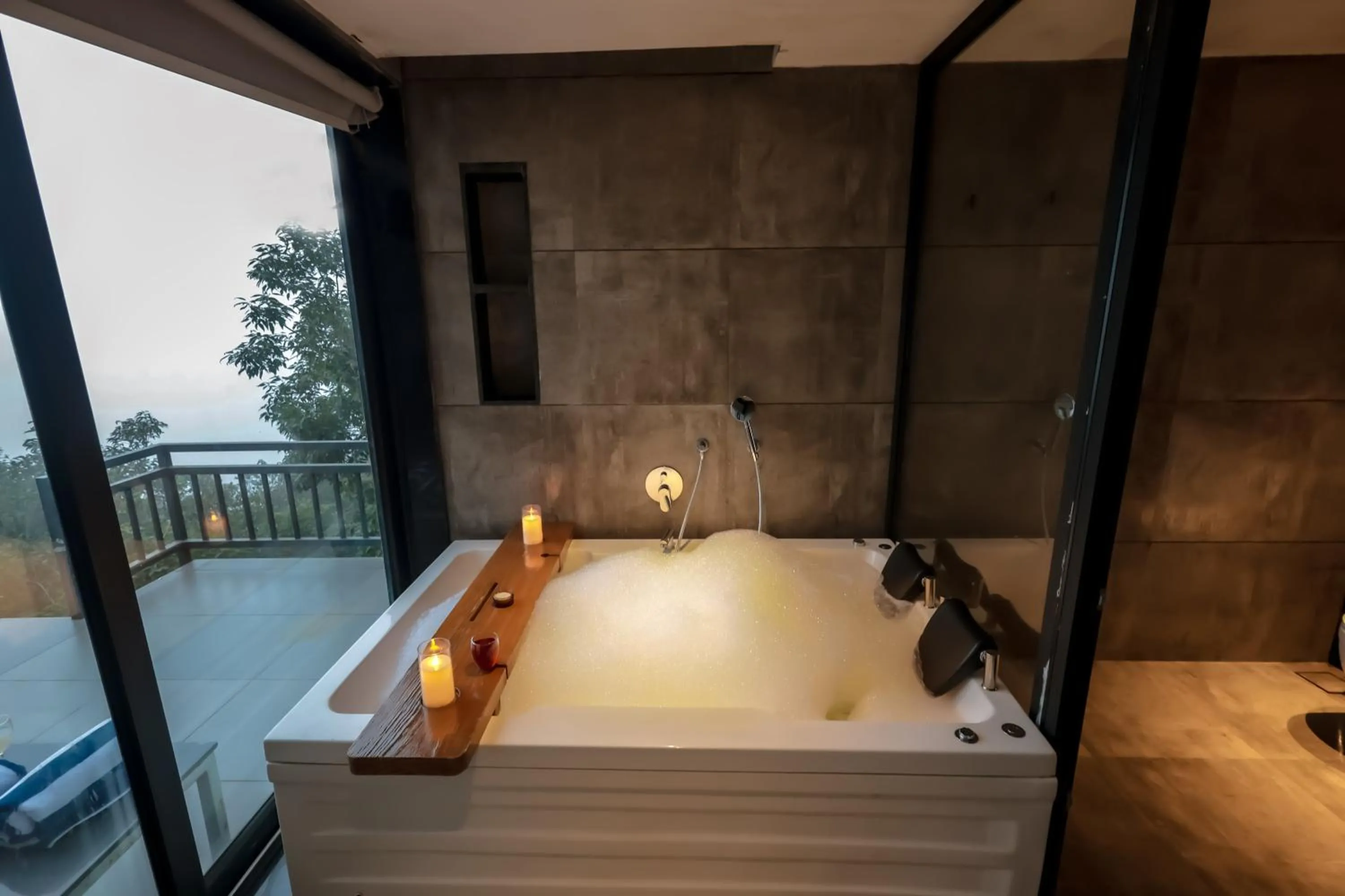 Bath, Bed in Vee Resort- The Suites of Royals