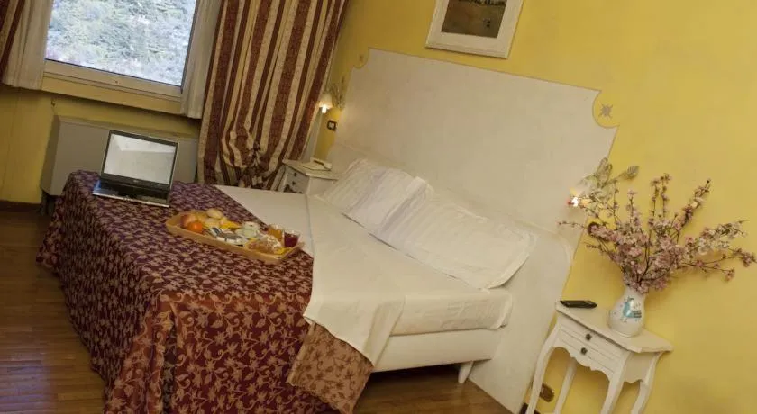 Bed in Ai Ronchi Motor Hotel Brescia