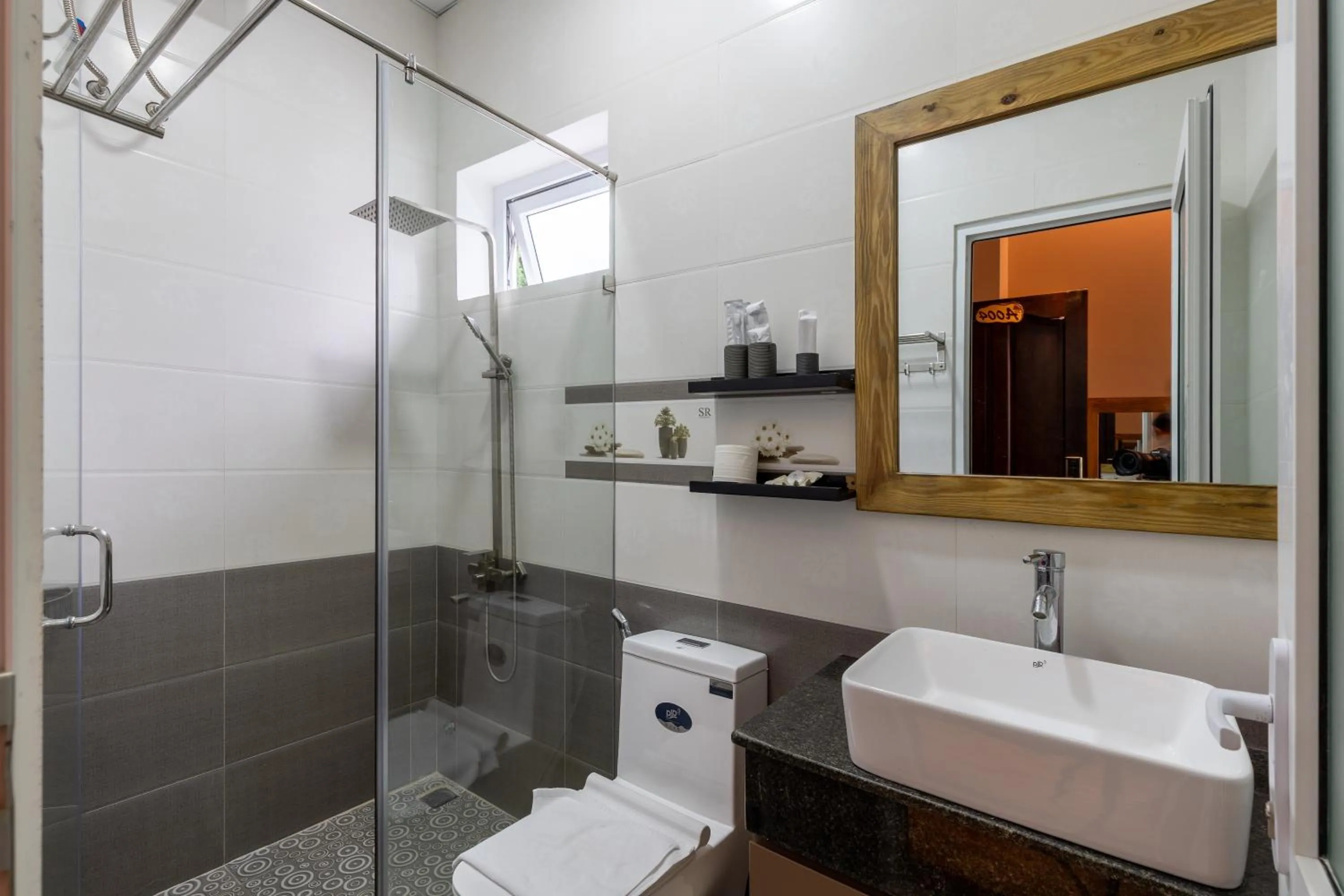 Bathroom in Relax Hotel by Ixorat