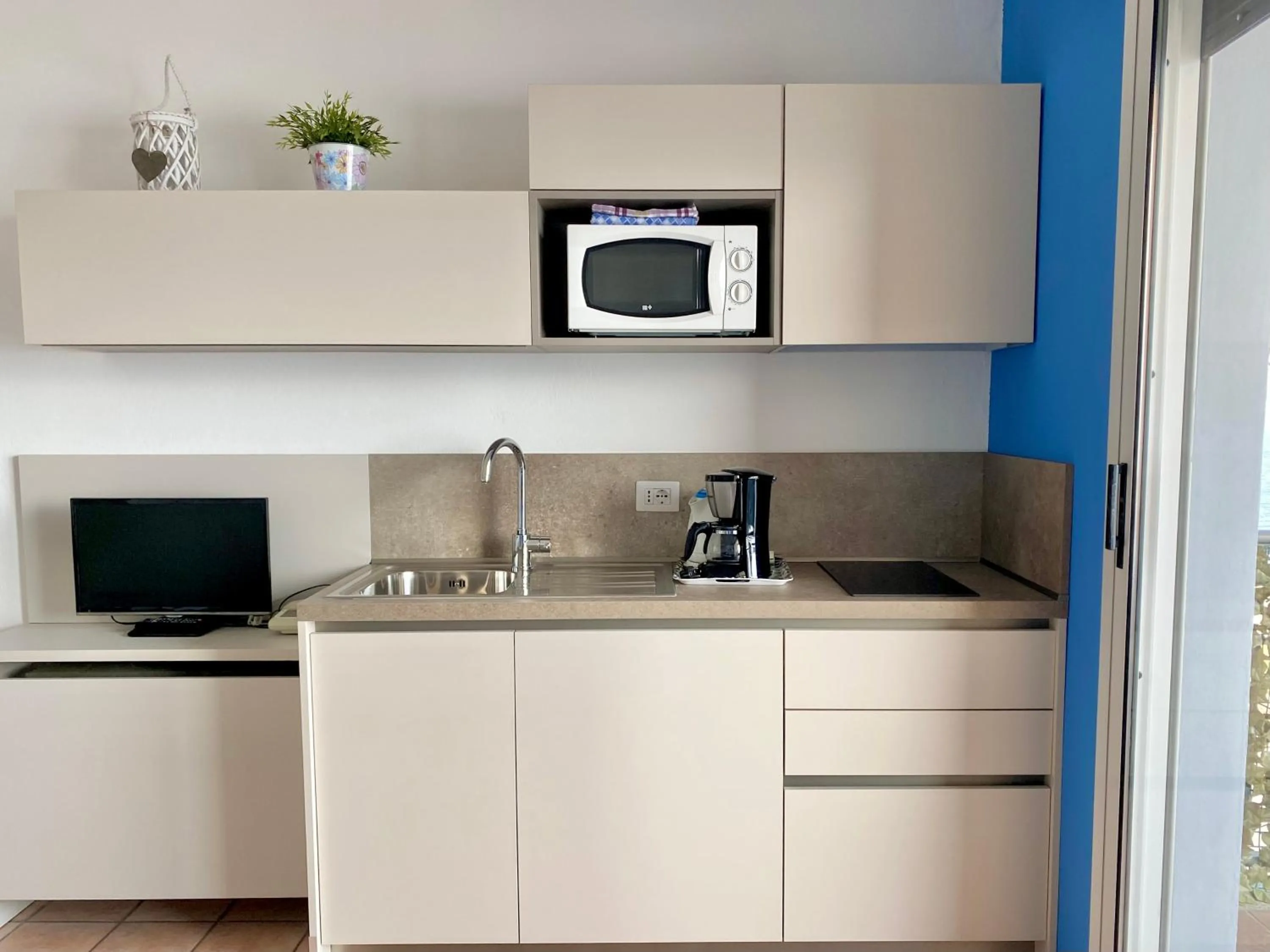 Kitchen or kitchenette in Residence Casa e Vela