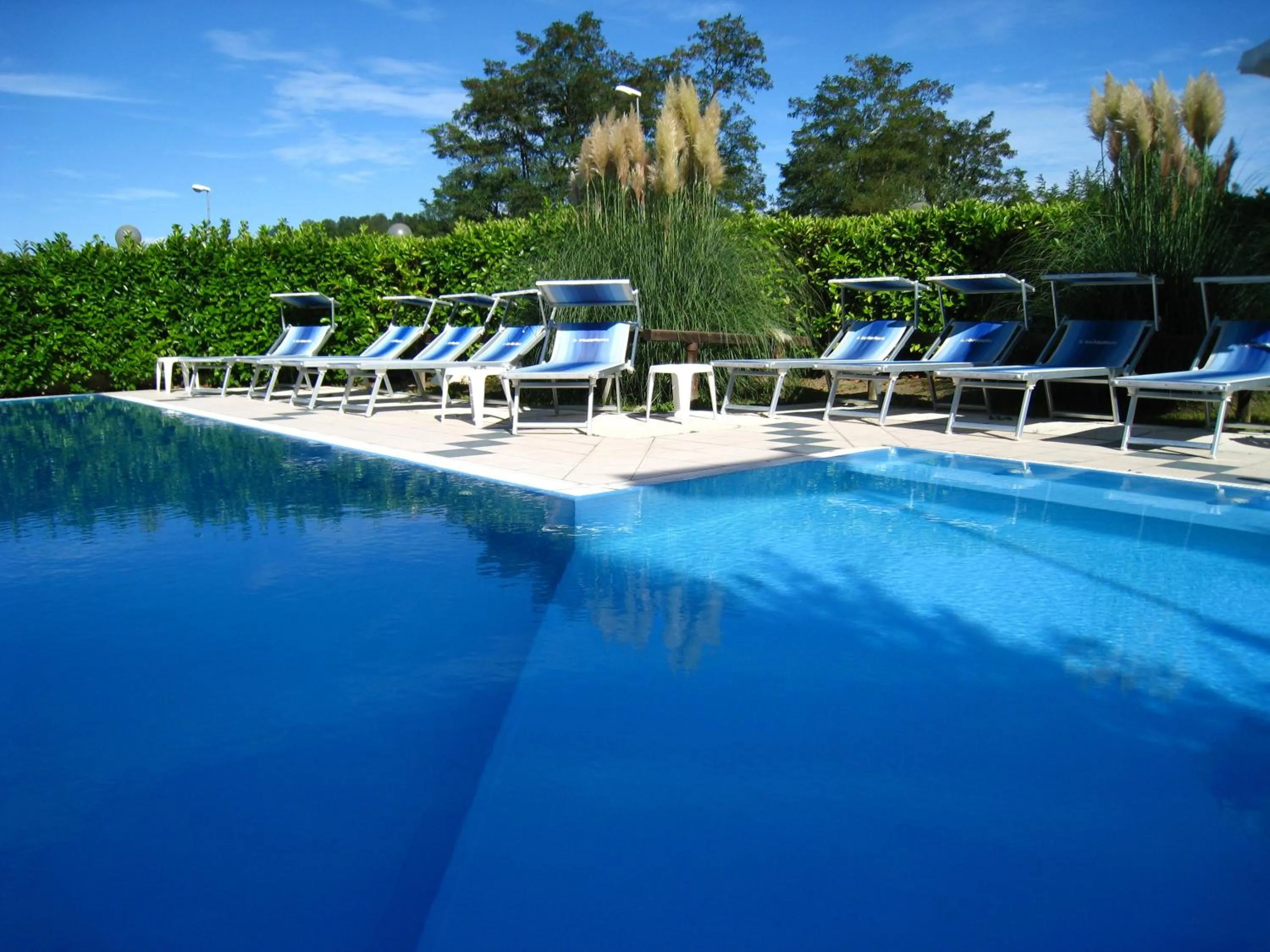 Swimming pool in Hotel Boomerang - Check-in & Meals in front at hotel Sporting