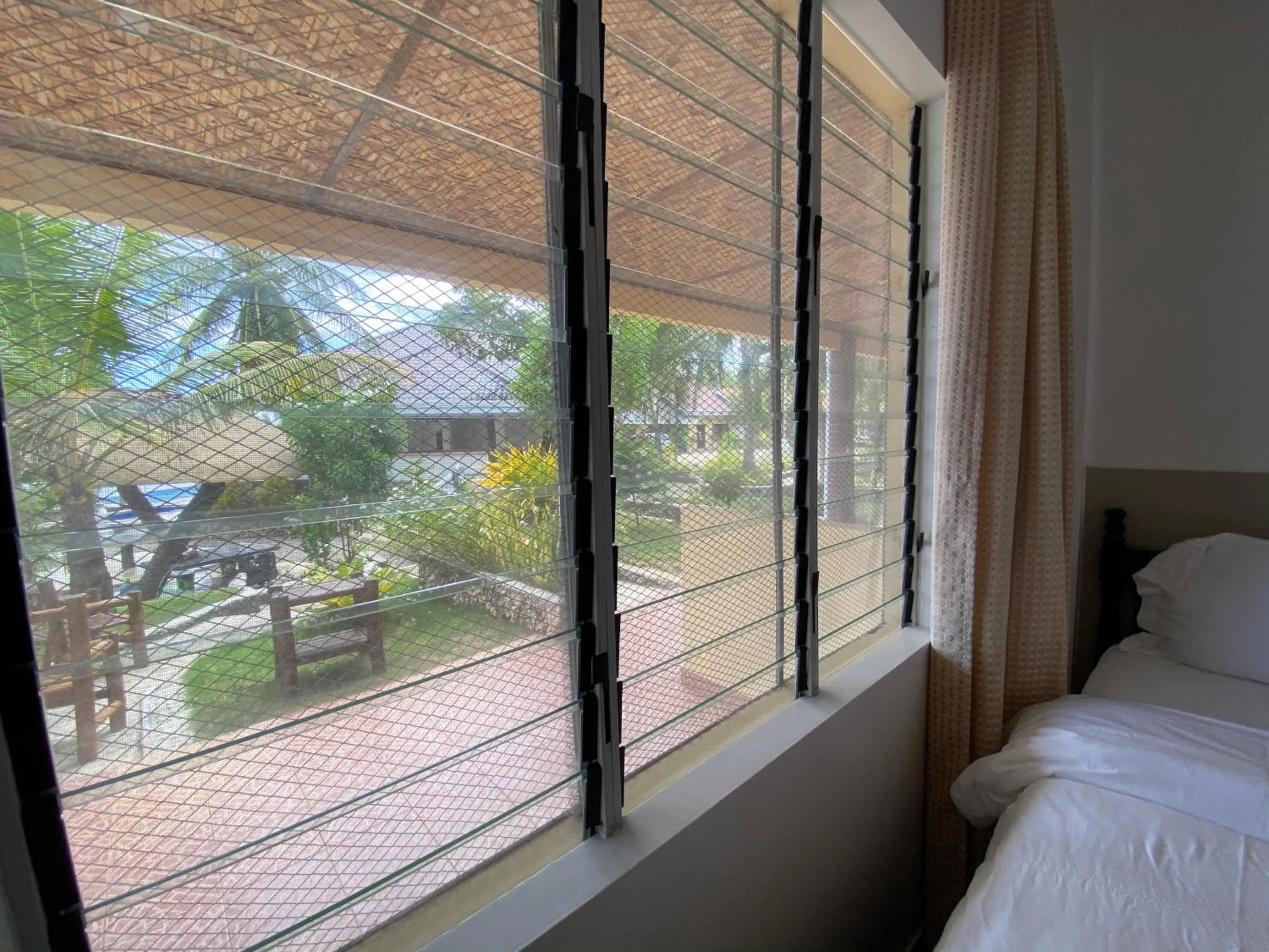 Garden view, Bed in Azure Camotes Resort Hotel