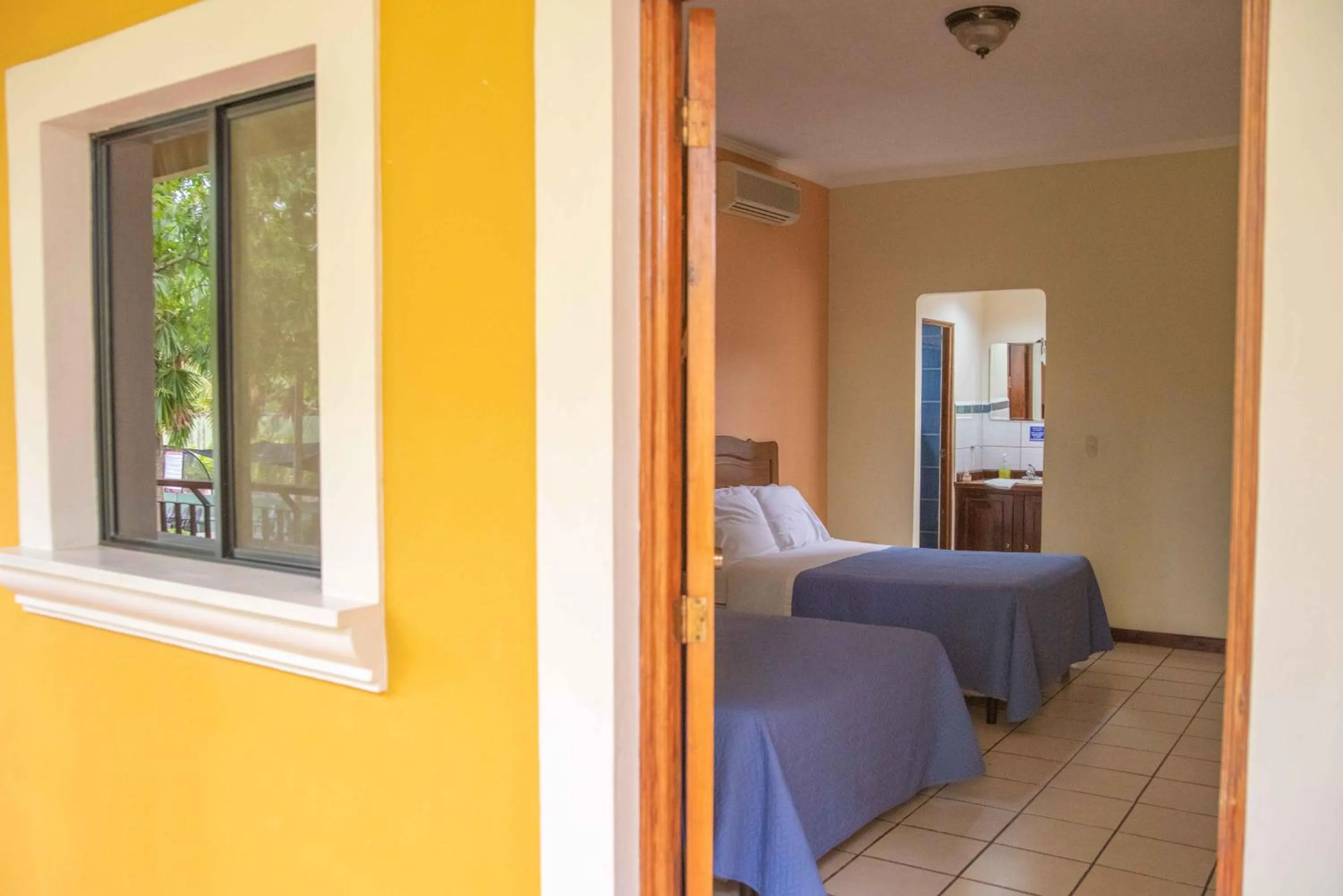 Property building, Bed in Hotel El Arco