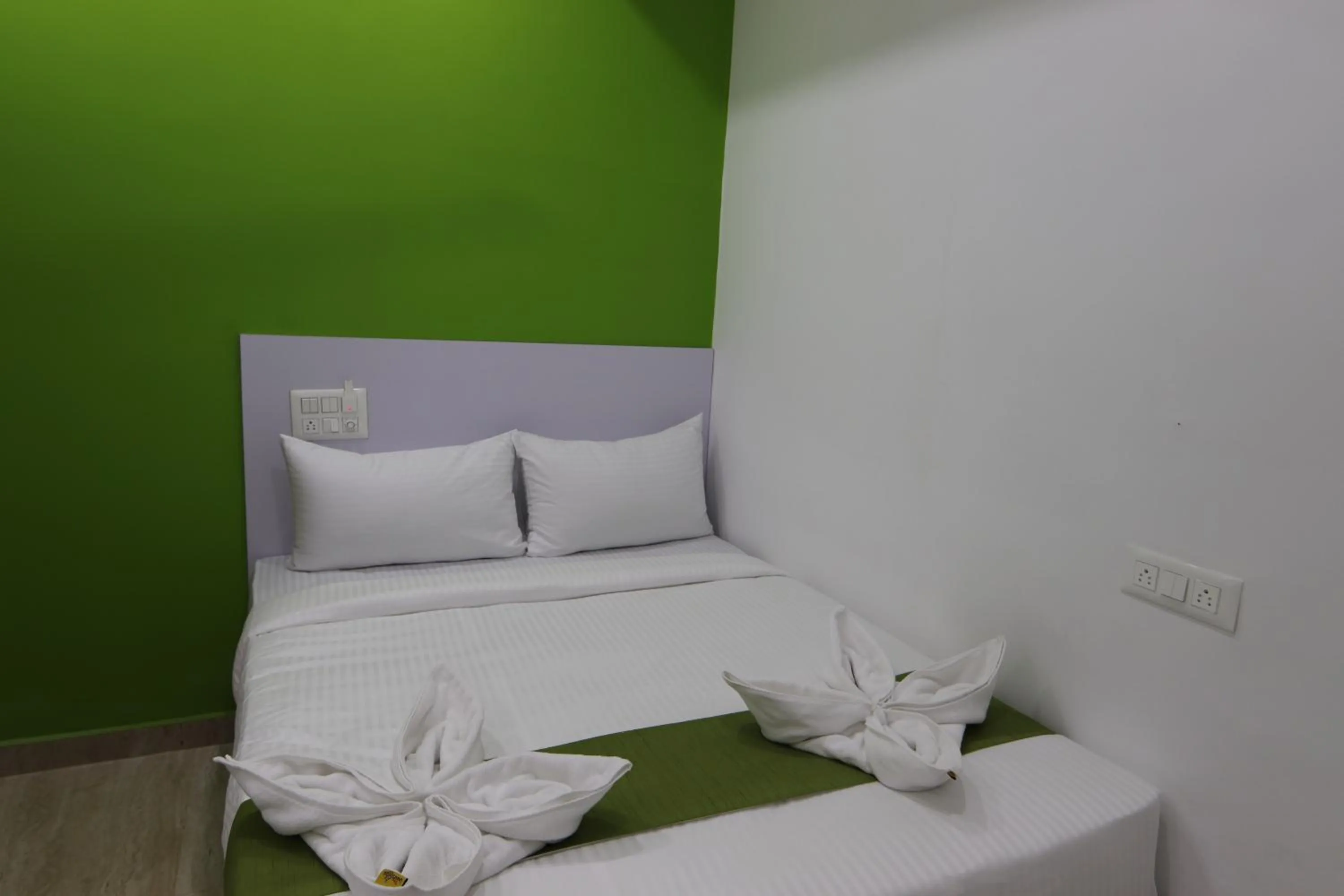 Bed in Athulya Stays