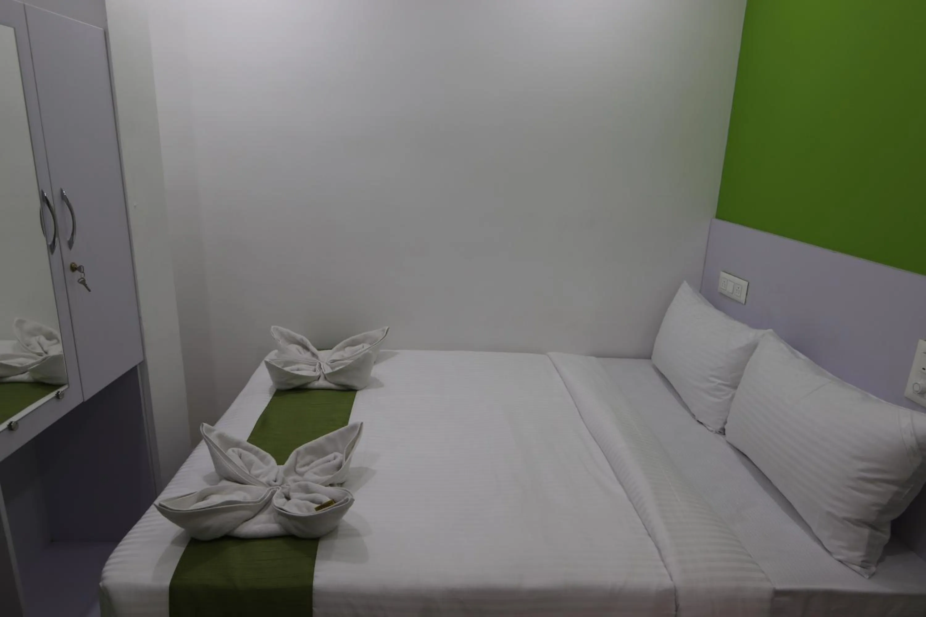 Bed in Athulya Stays