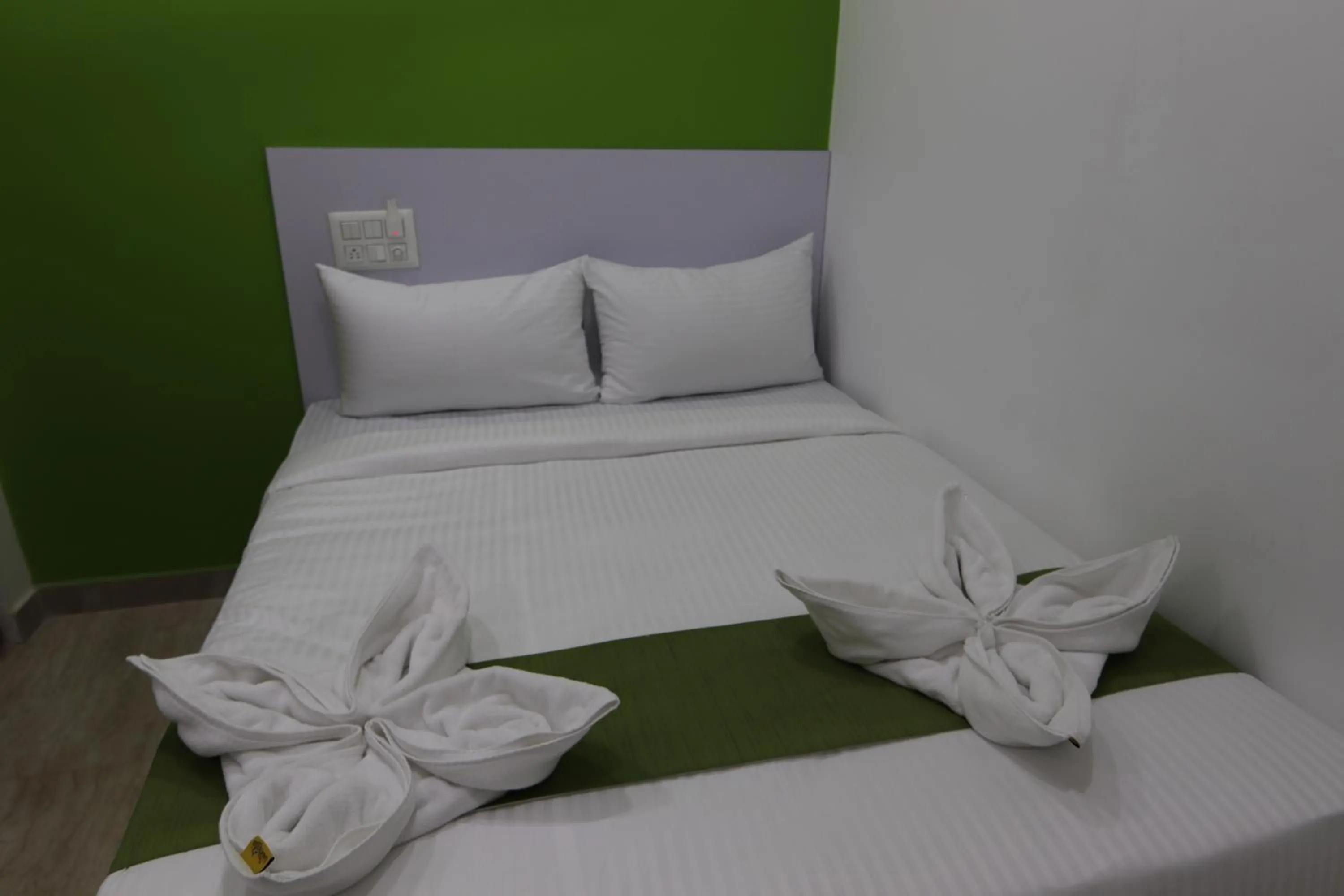 Bed in Athulya Stays