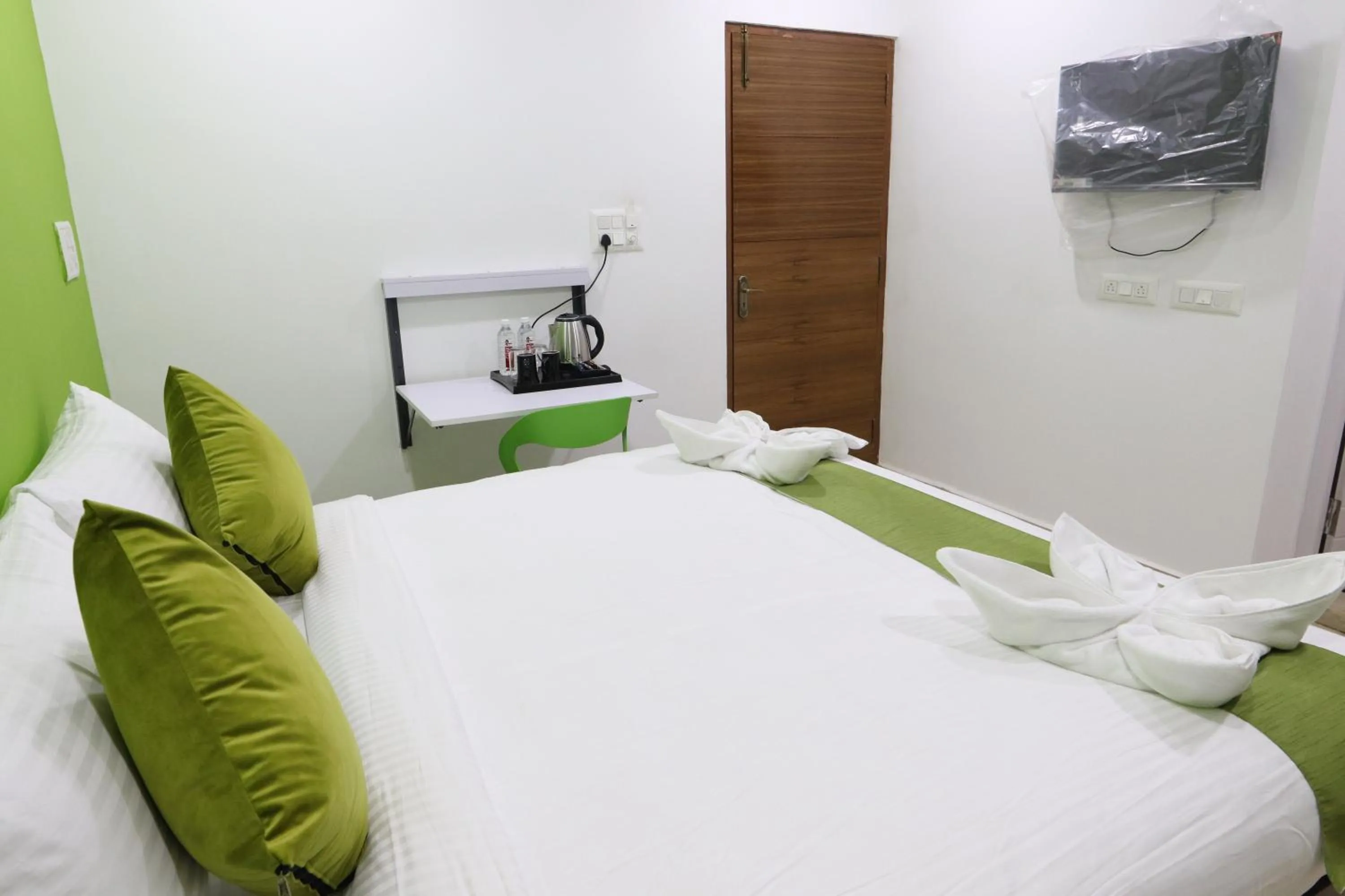 Bed in Athulya Stays