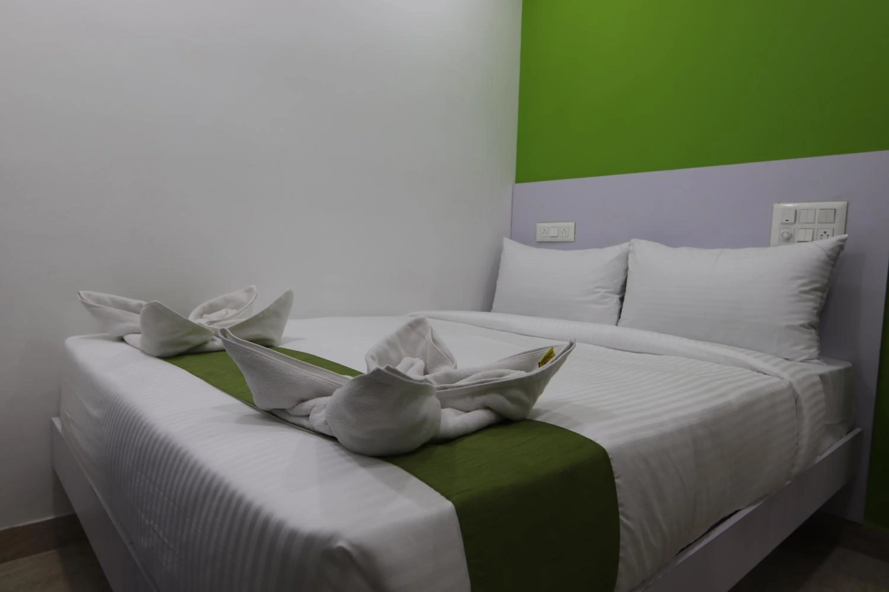 Bed in Athulya Stays