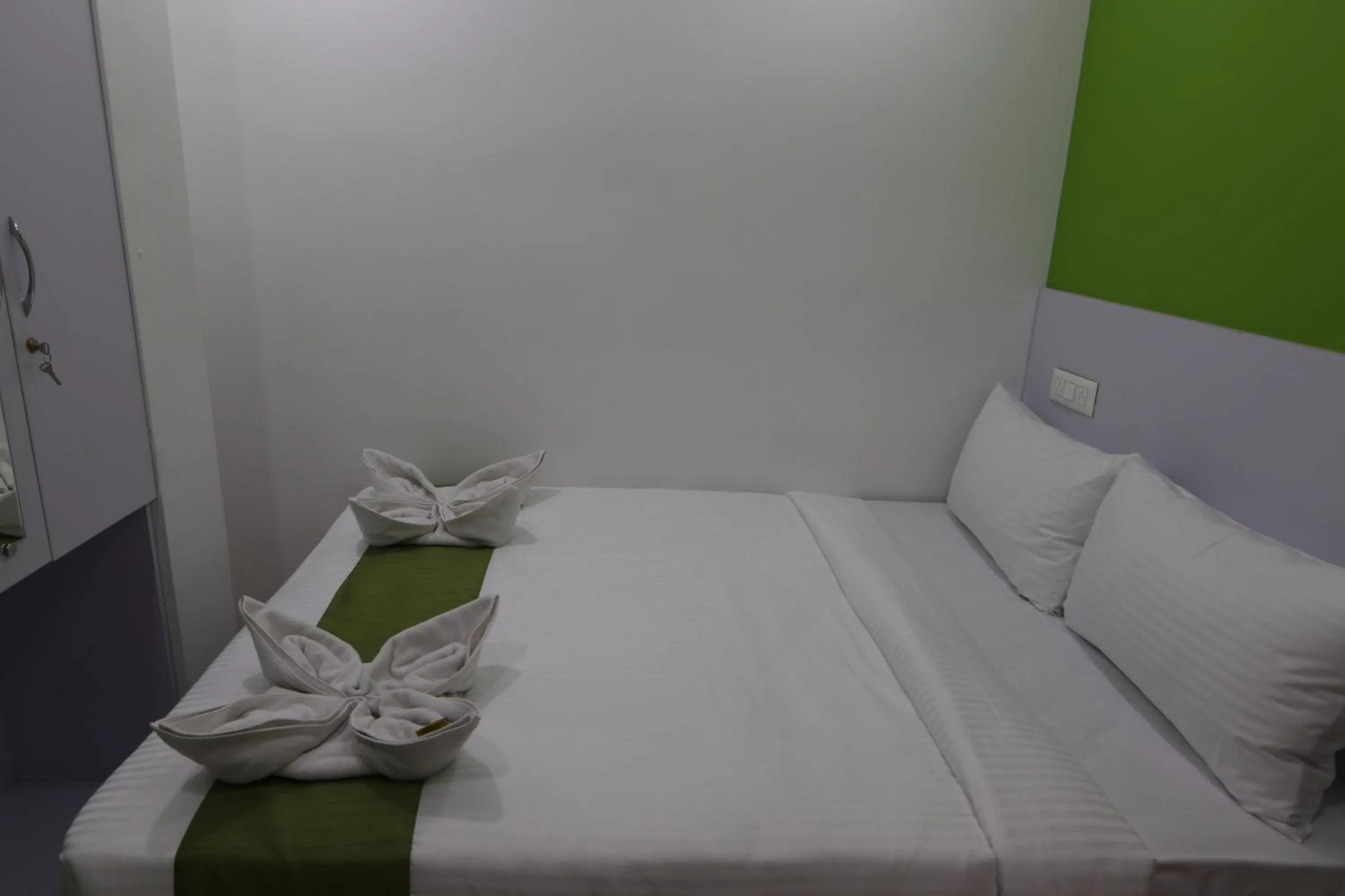 Bed in Athulya Stays