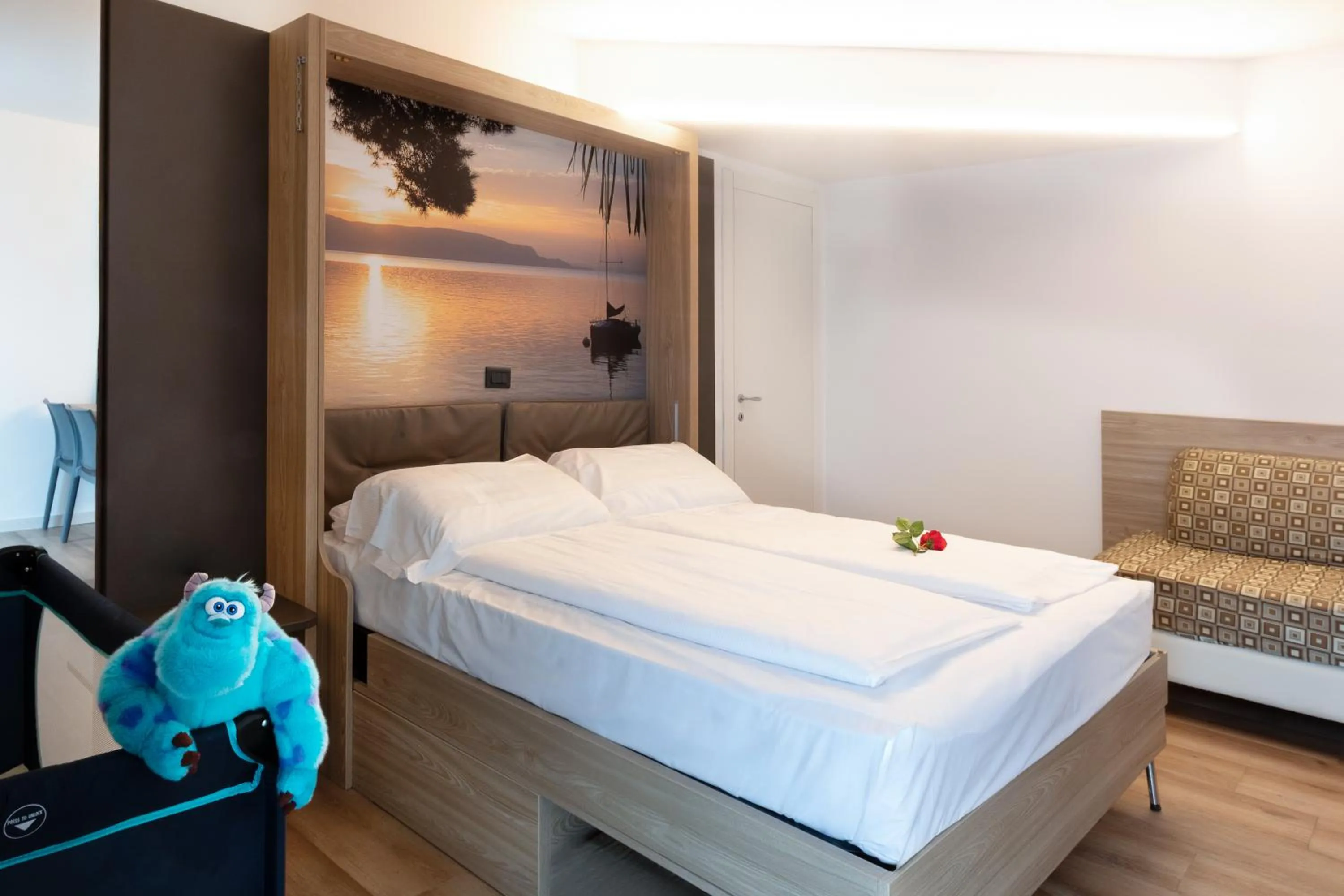 Bed in Ambassador Suite Hotel