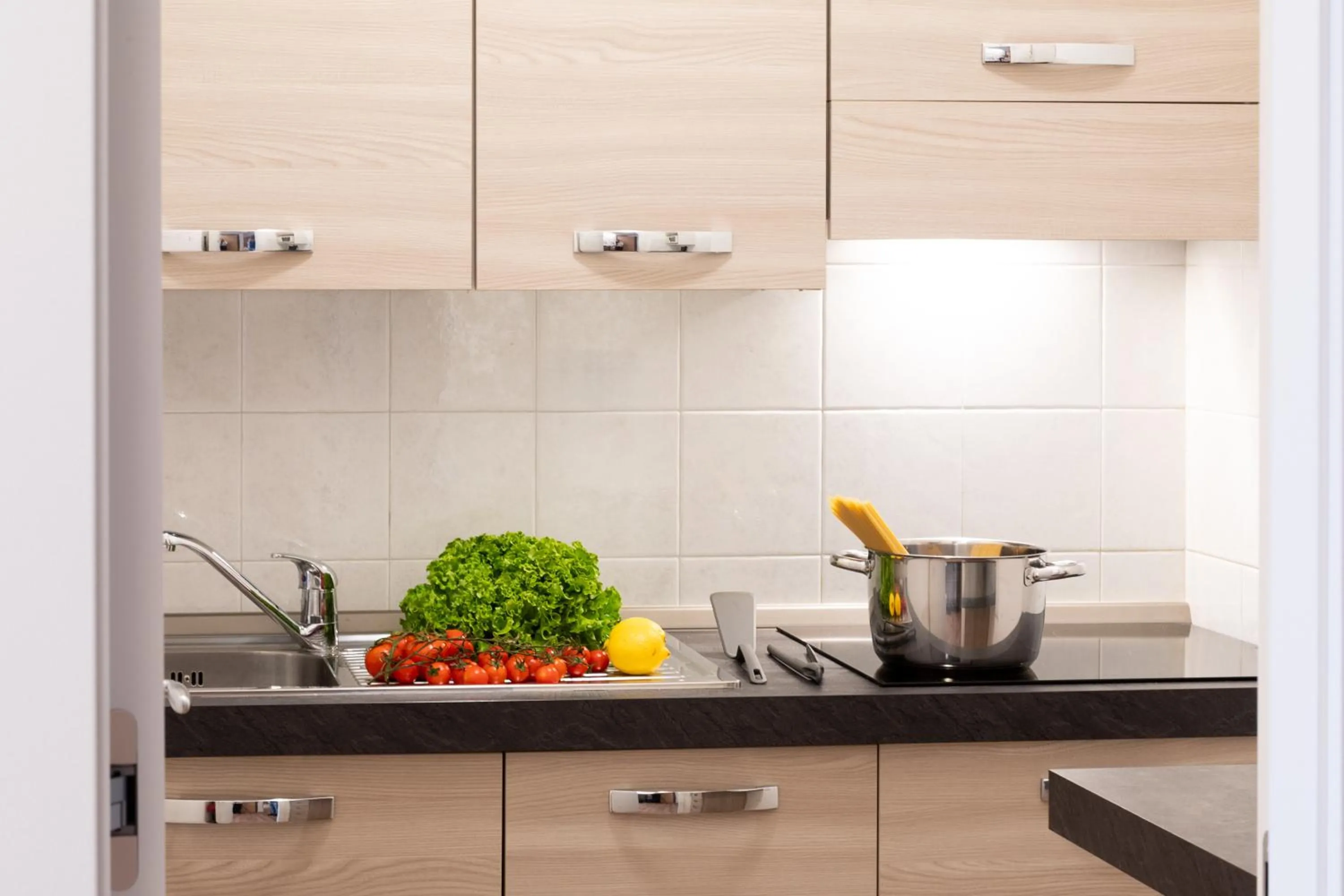 kitchen in Ambassador Suite Hotel