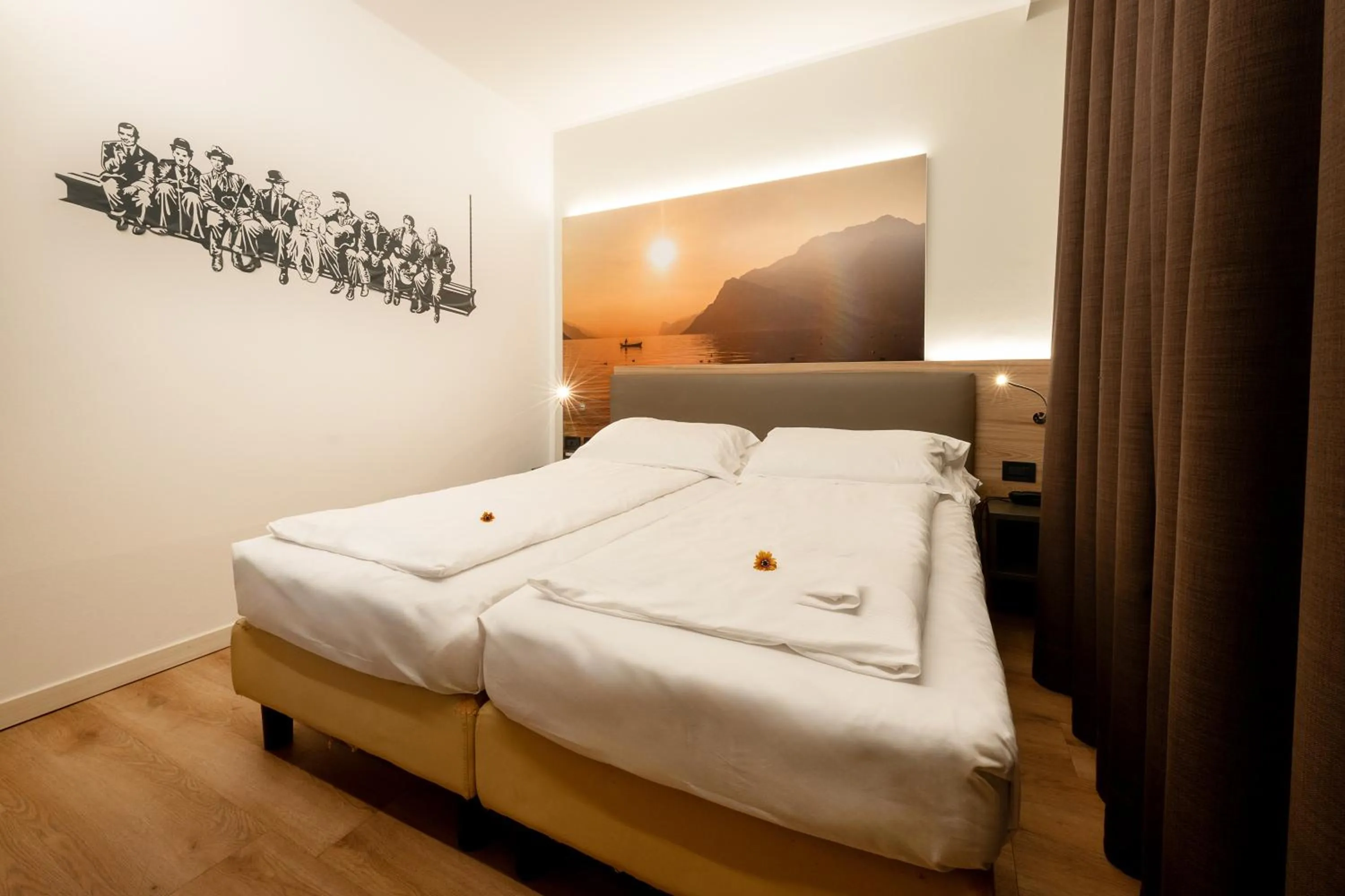 Bed in Ambassador Suite Hotel