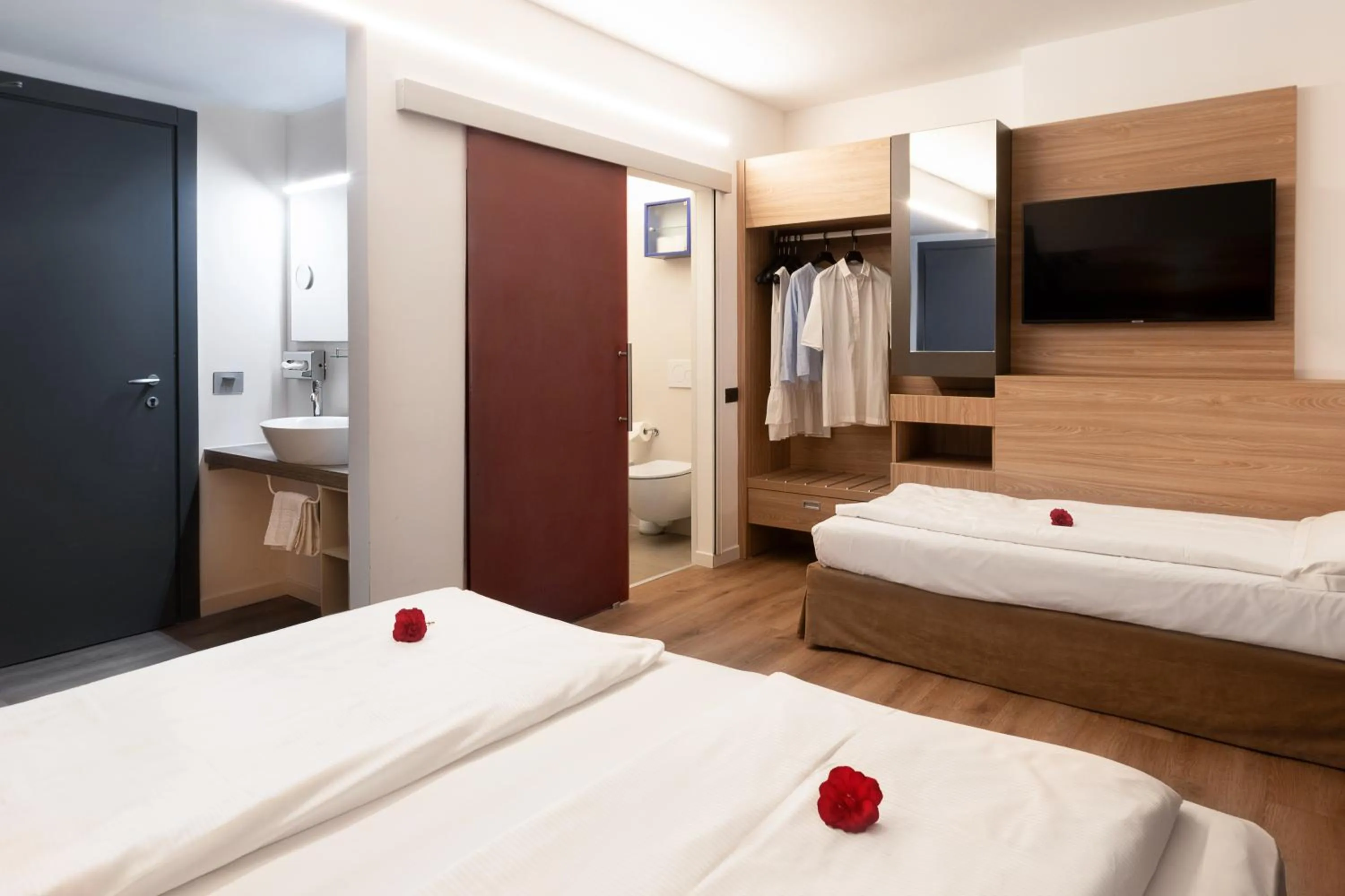 Bed in Ambassador Suite Hotel