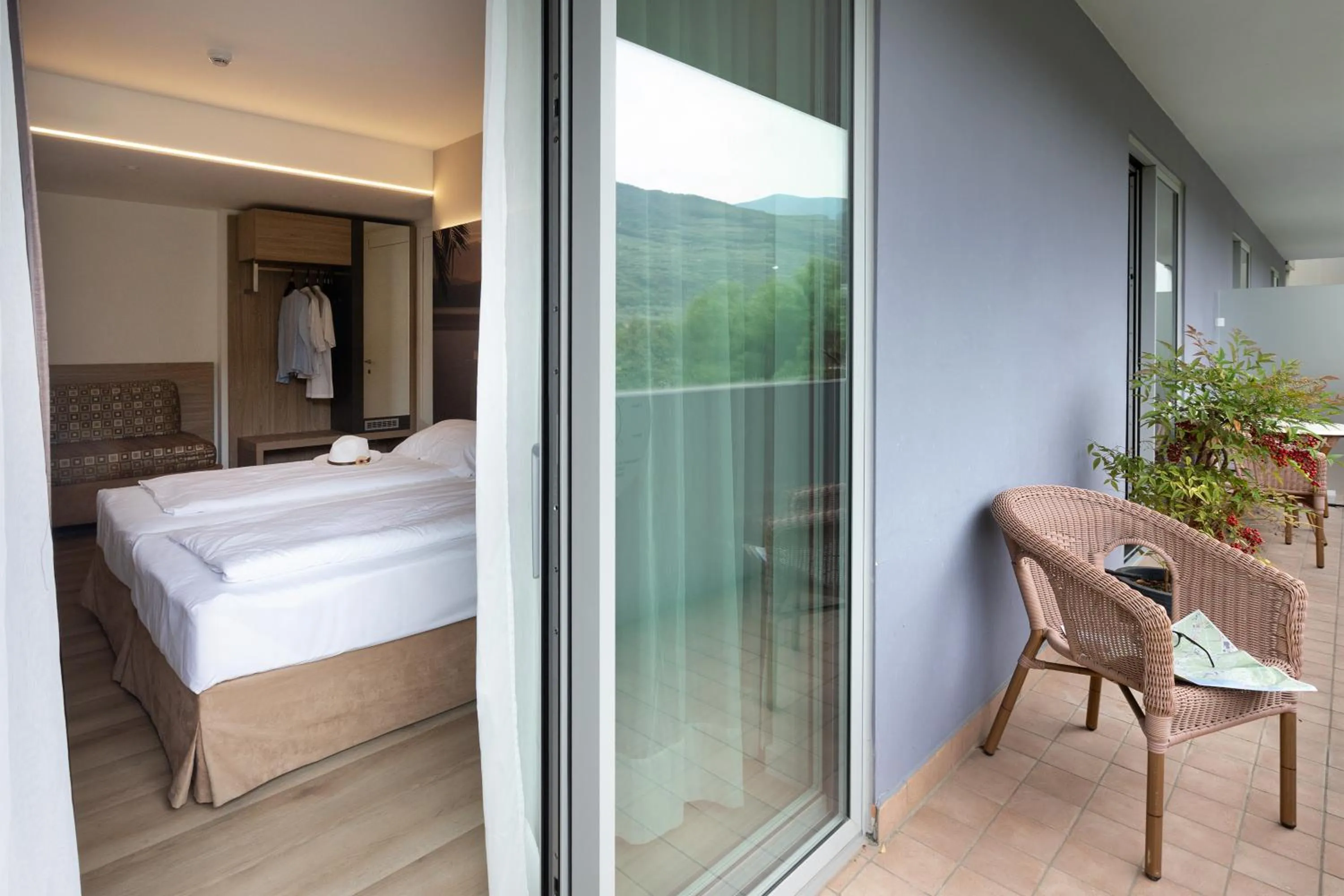 Balcony/Terrace, Bed in Ambassador Suite Hotel