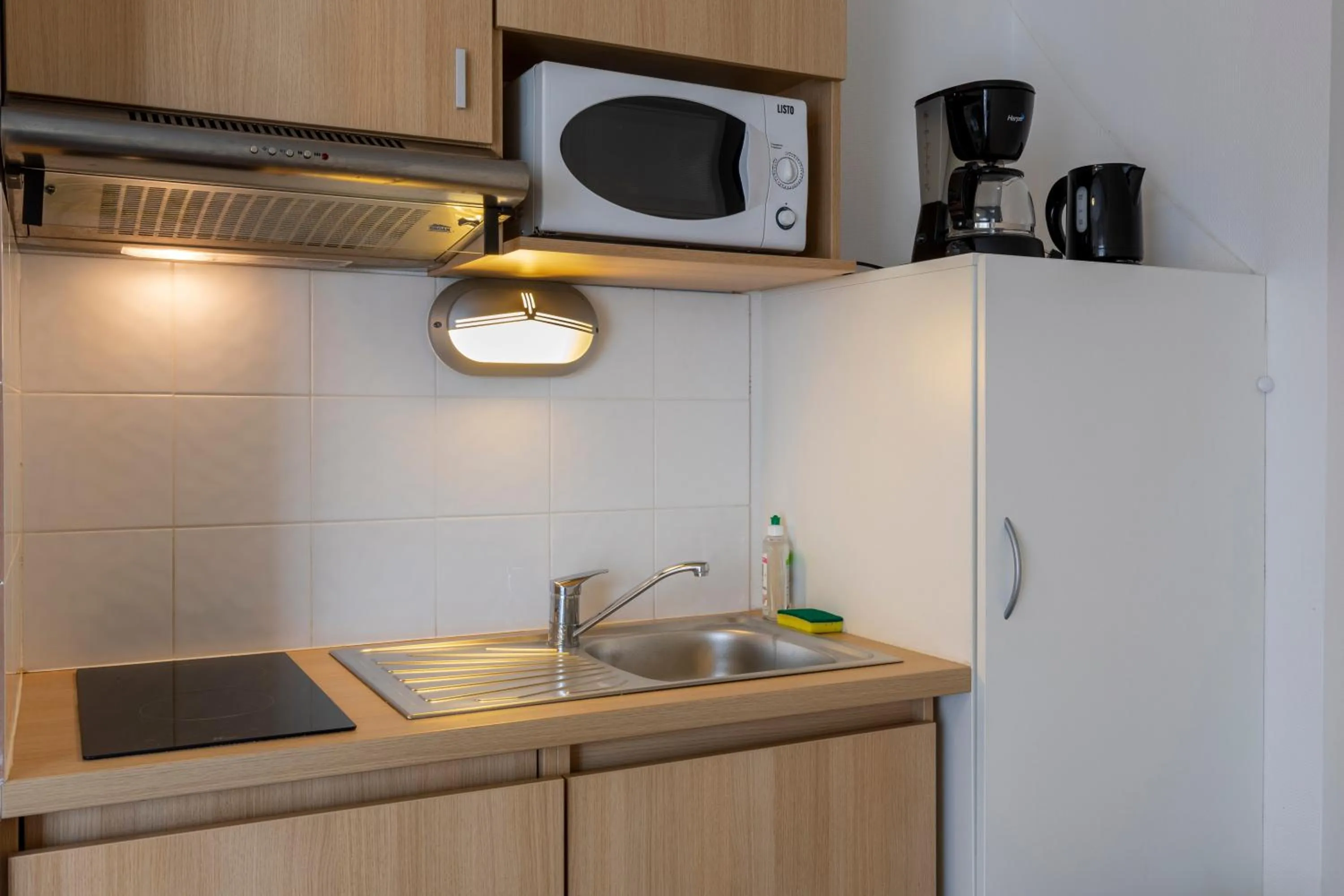 Kitchen or kitchenette in The Originals Residence, Kosy Appart'hotels Troyes City & Park