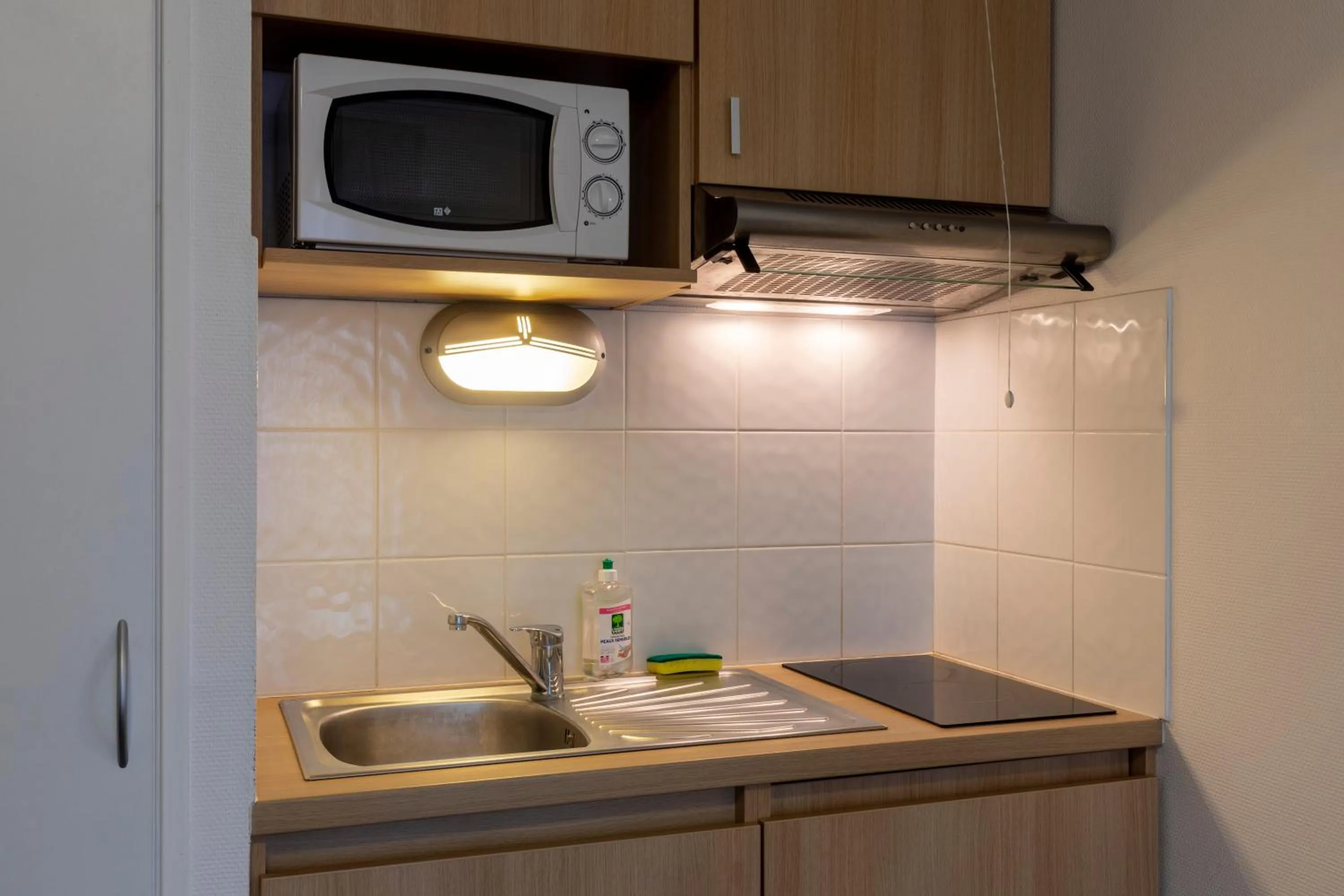 Kitchen or kitchenette in The Originals Residence, Kosy Appart'hotels Troyes City & Park