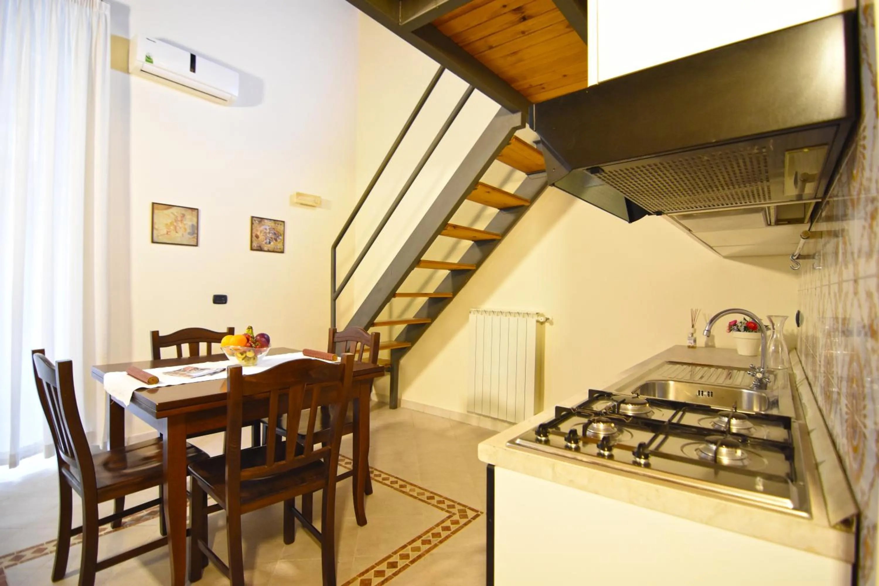 Kitchen or kitchenette in Case Così Apartments - Napoli