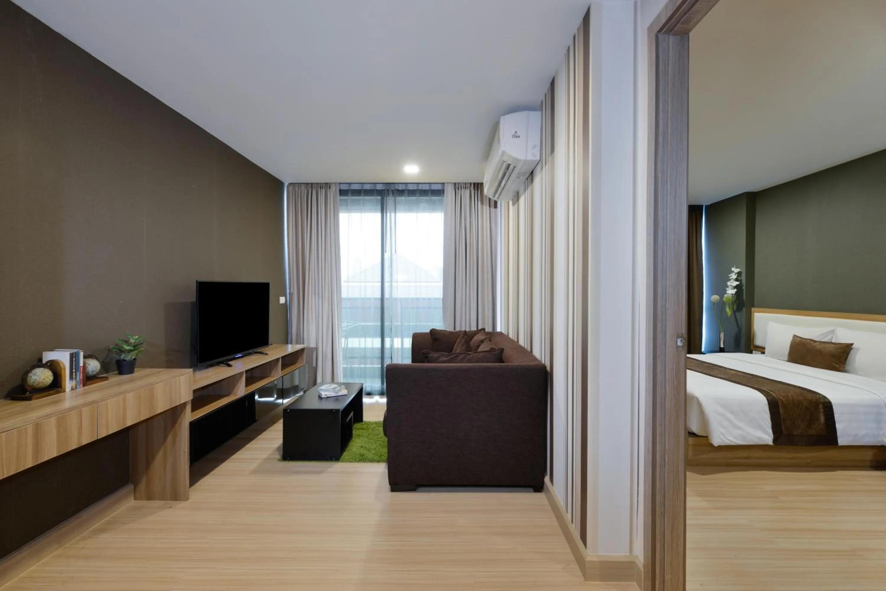 Living room, Bed in Ramada by Wyndham Bangkok Ten Ekamai Residences