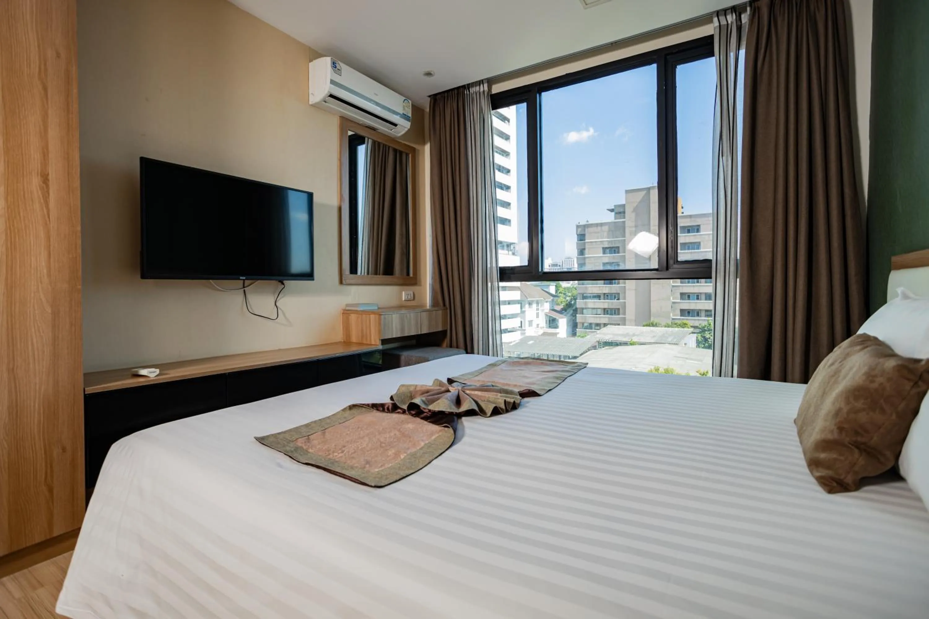 Bed in Ramada by Wyndham Bangkok Ten Ekamai Residences