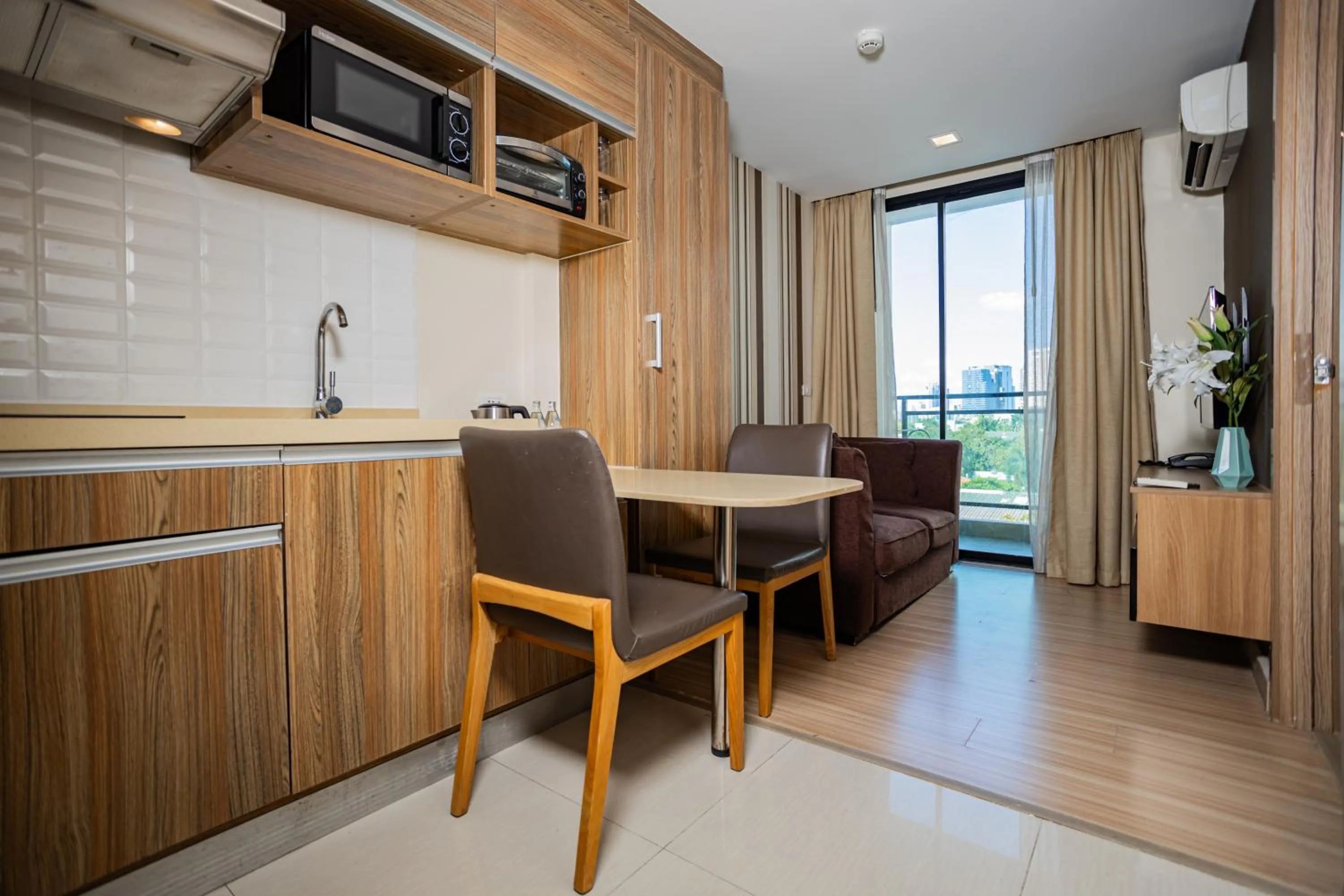 Living room in Ramada by Wyndham Bangkok Ten Ekamai Residences