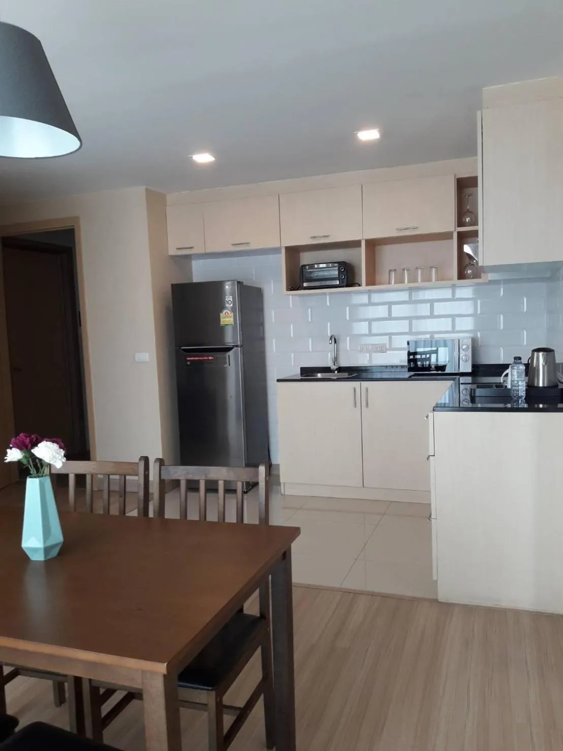 Kitchen or kitchenette in Ramada by Wyndham Bangkok Ten Ekamai Residences
