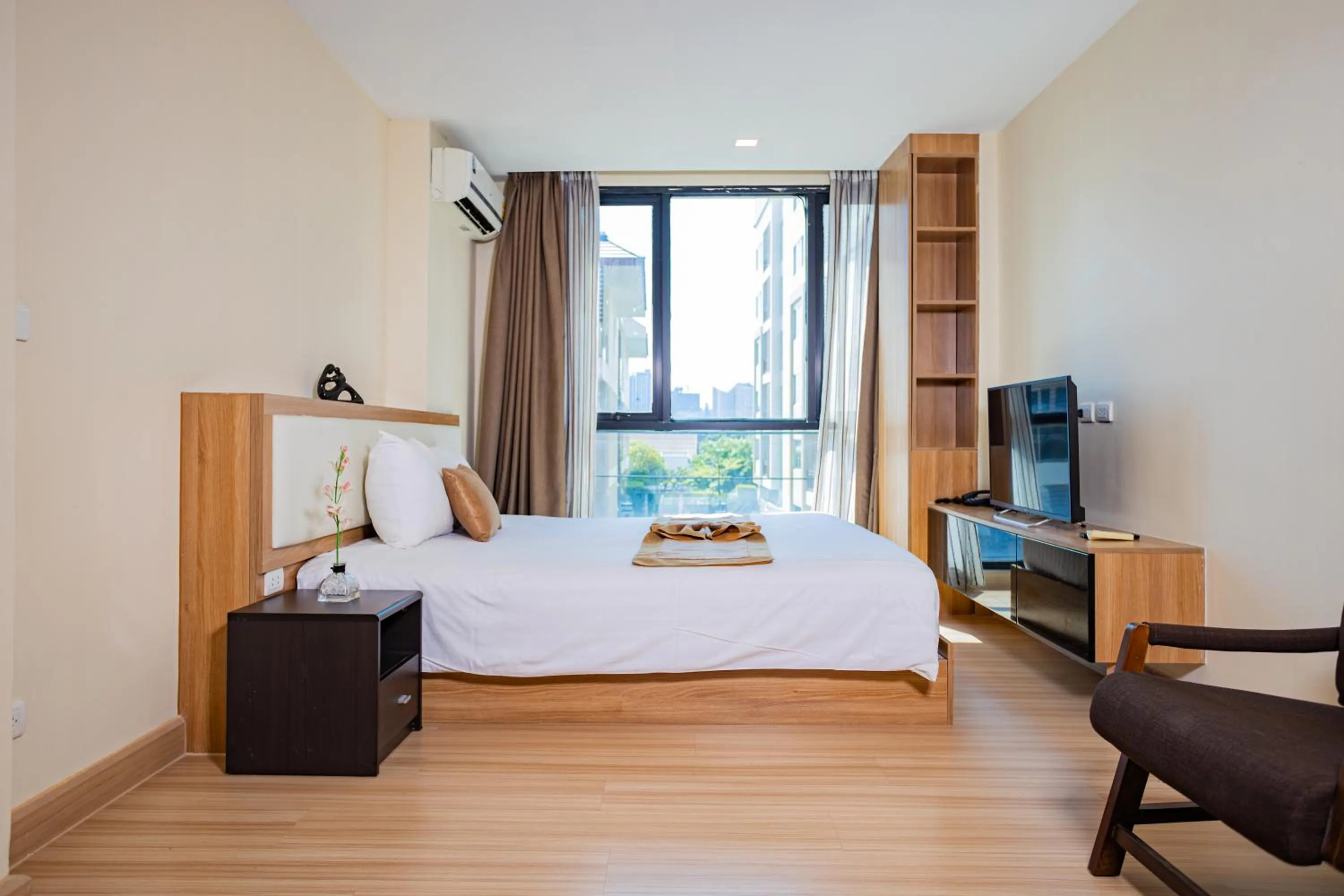 Bed in Ramada by Wyndham Bangkok Ten Ekamai Residences