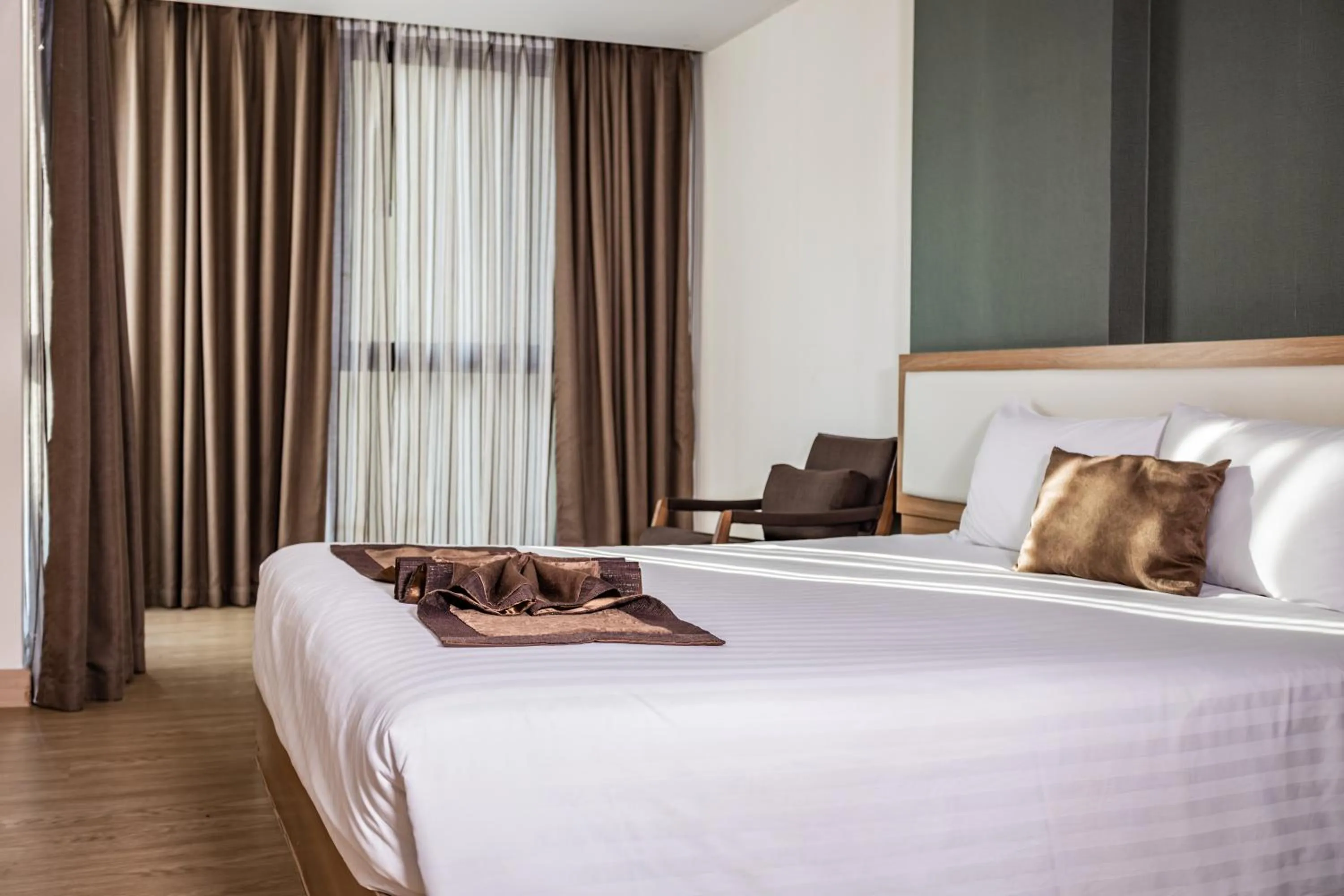 Bed in Ramada by Wyndham Bangkok Ten Ekamai Residences
