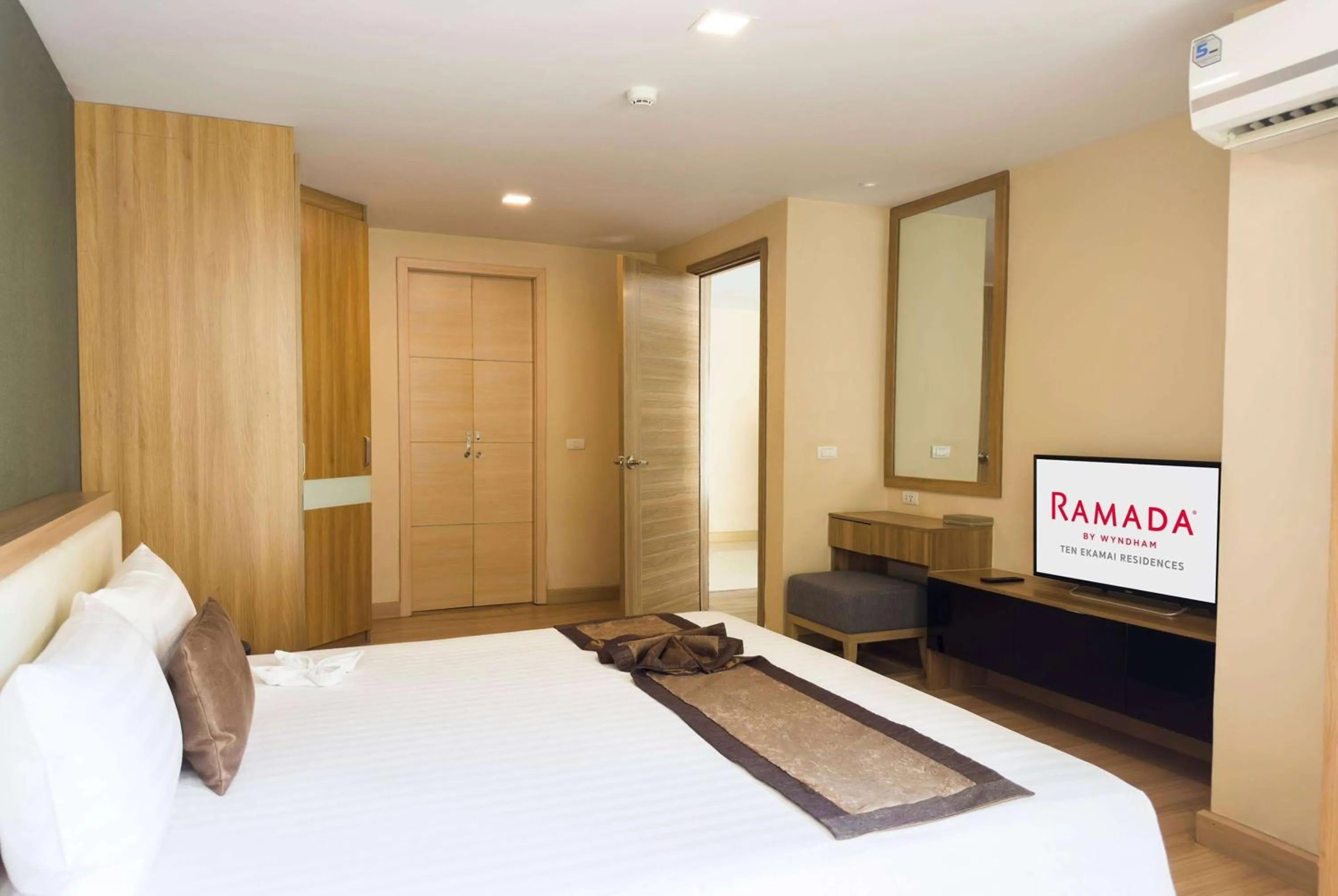 Photo of the whole room, Bed in Ramada by Wyndham Bangkok Ten Ekamai Residences