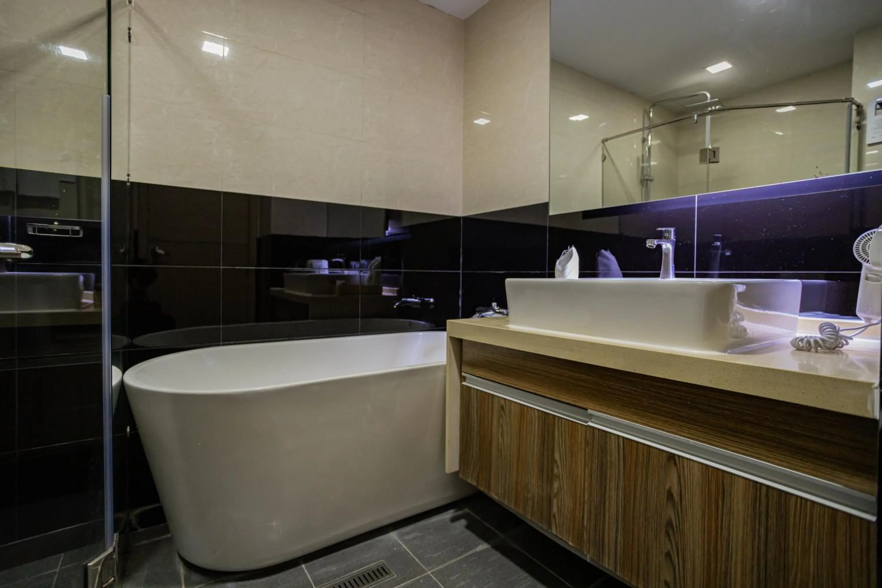 Bathroom in Ramada by Wyndham Bangkok Ten Ekamai Residences