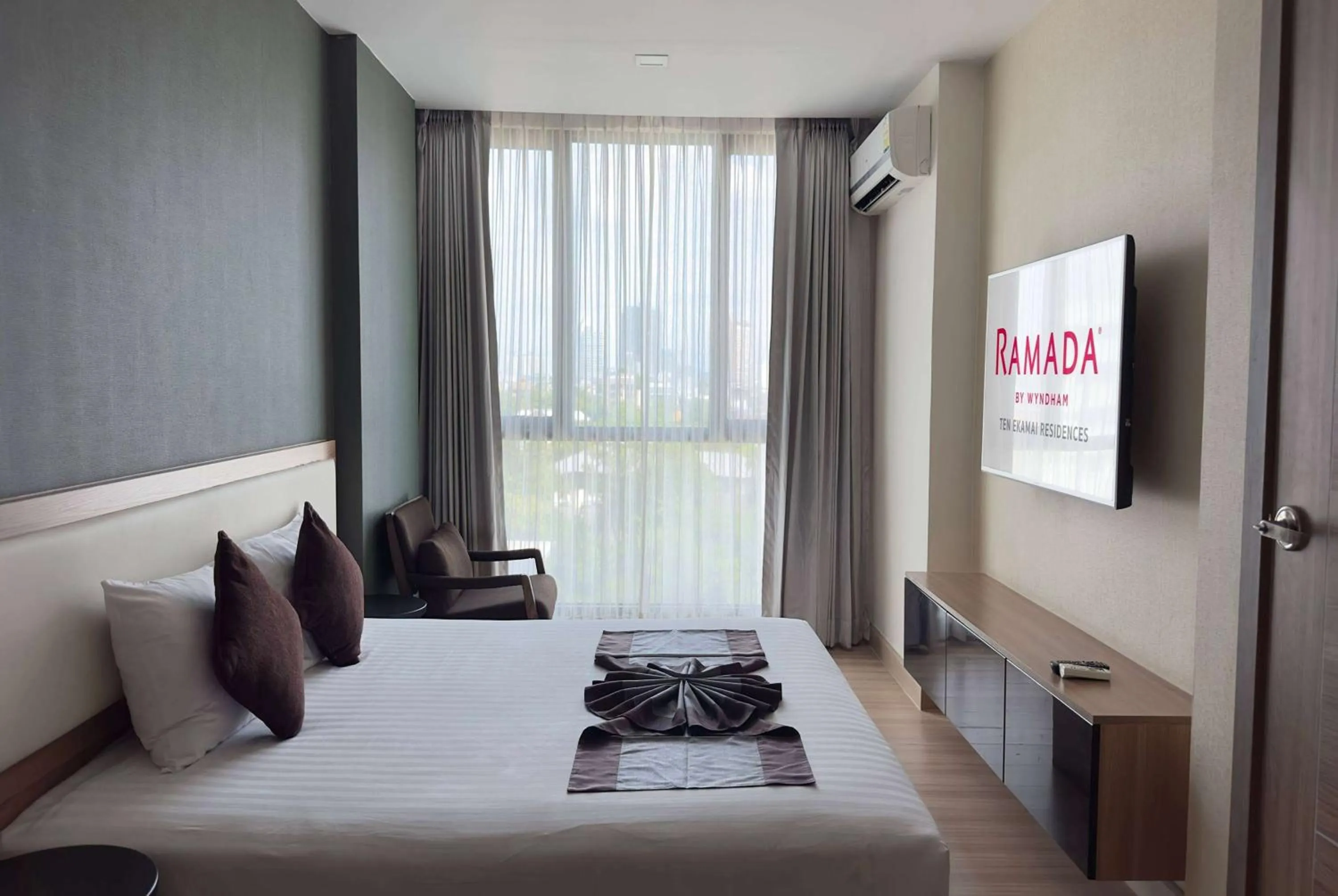 Photo of the whole room, Bed in Ramada by Wyndham Bangkok Ten Ekamai Residences