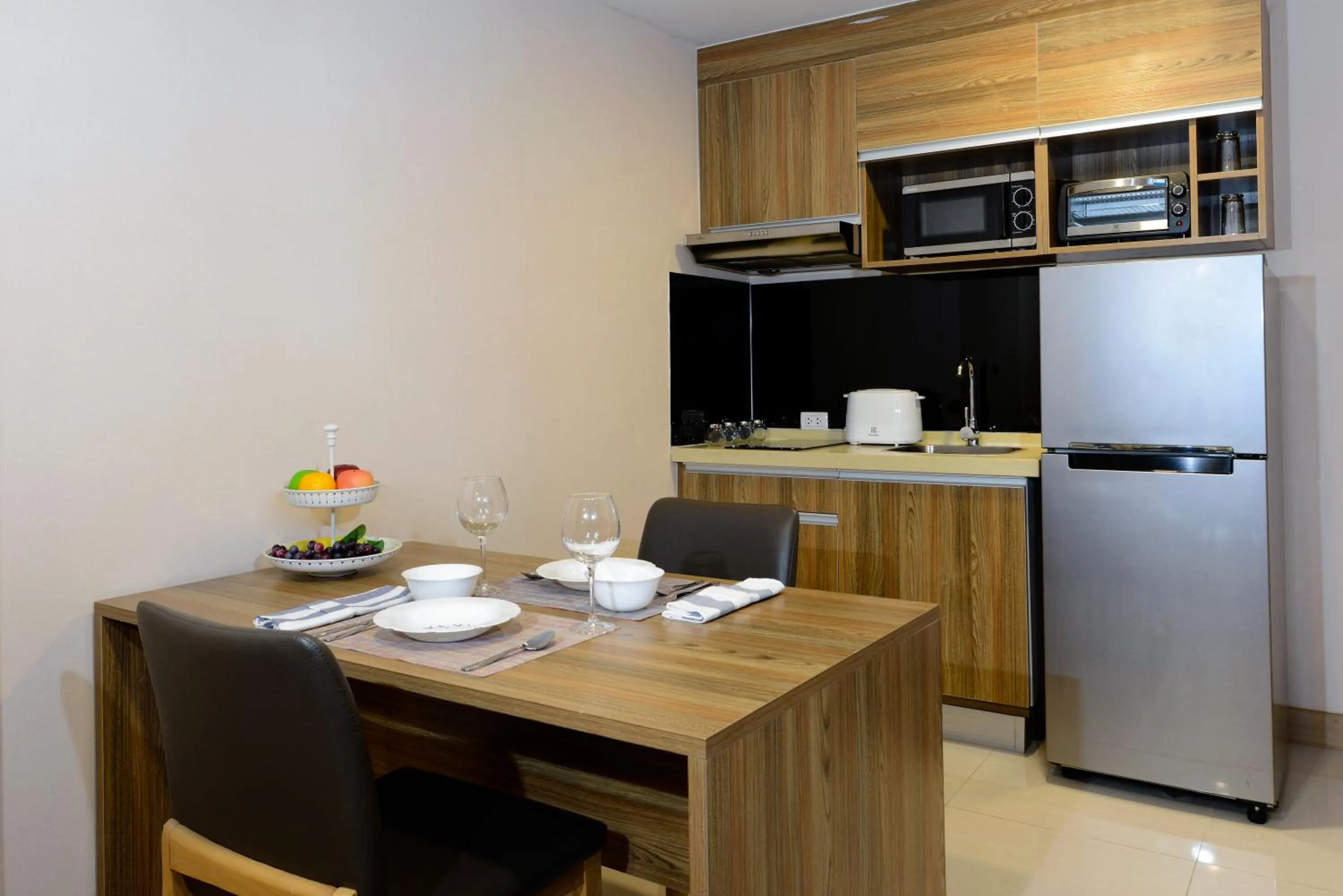 Kitchen or kitchenette in Ramada by Wyndham Bangkok Ten Ekamai Residences