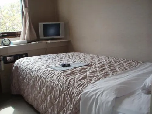 Bed in Jyonai Hotel