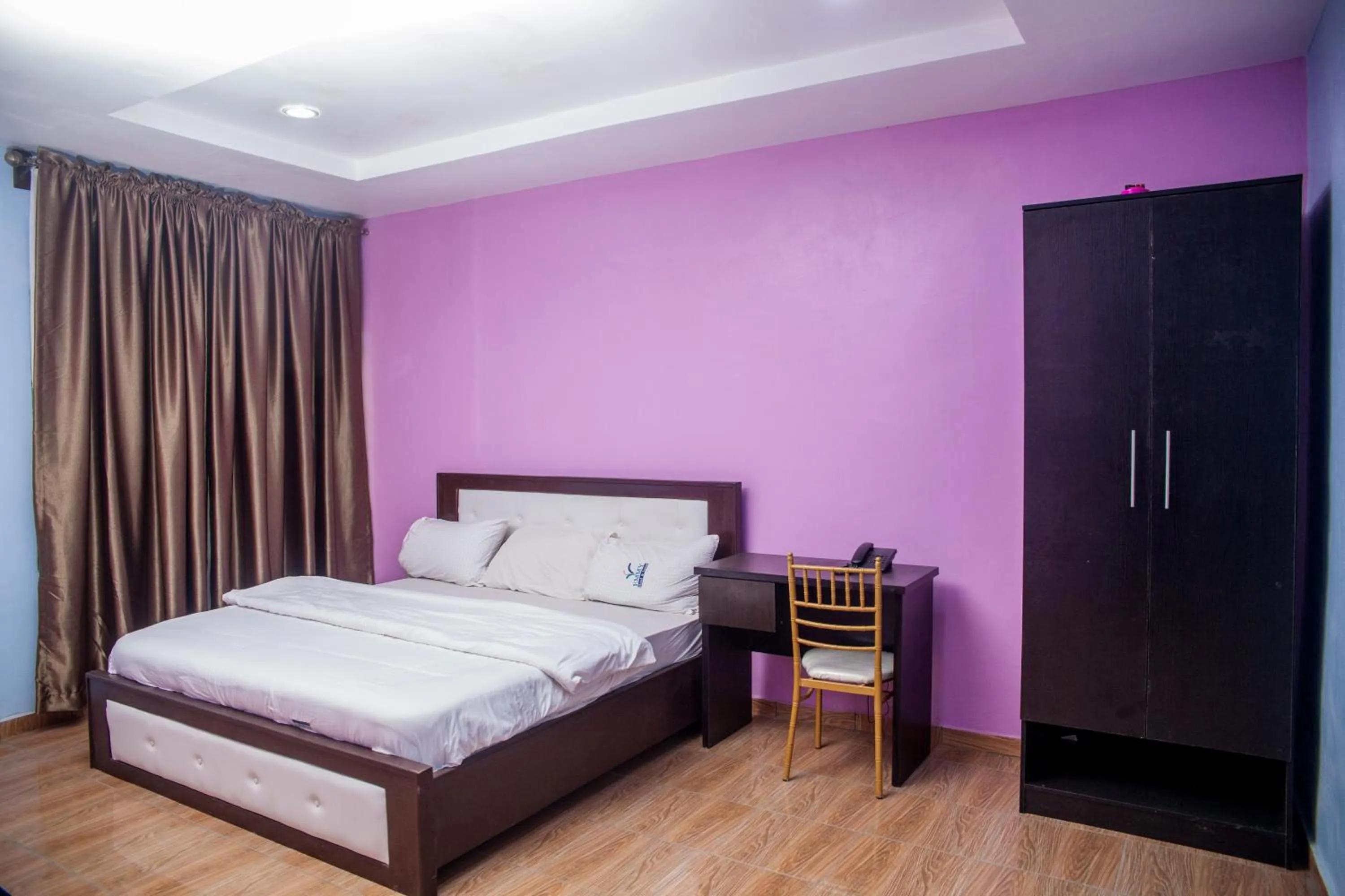 Bed in Emmy Hotels & Suites