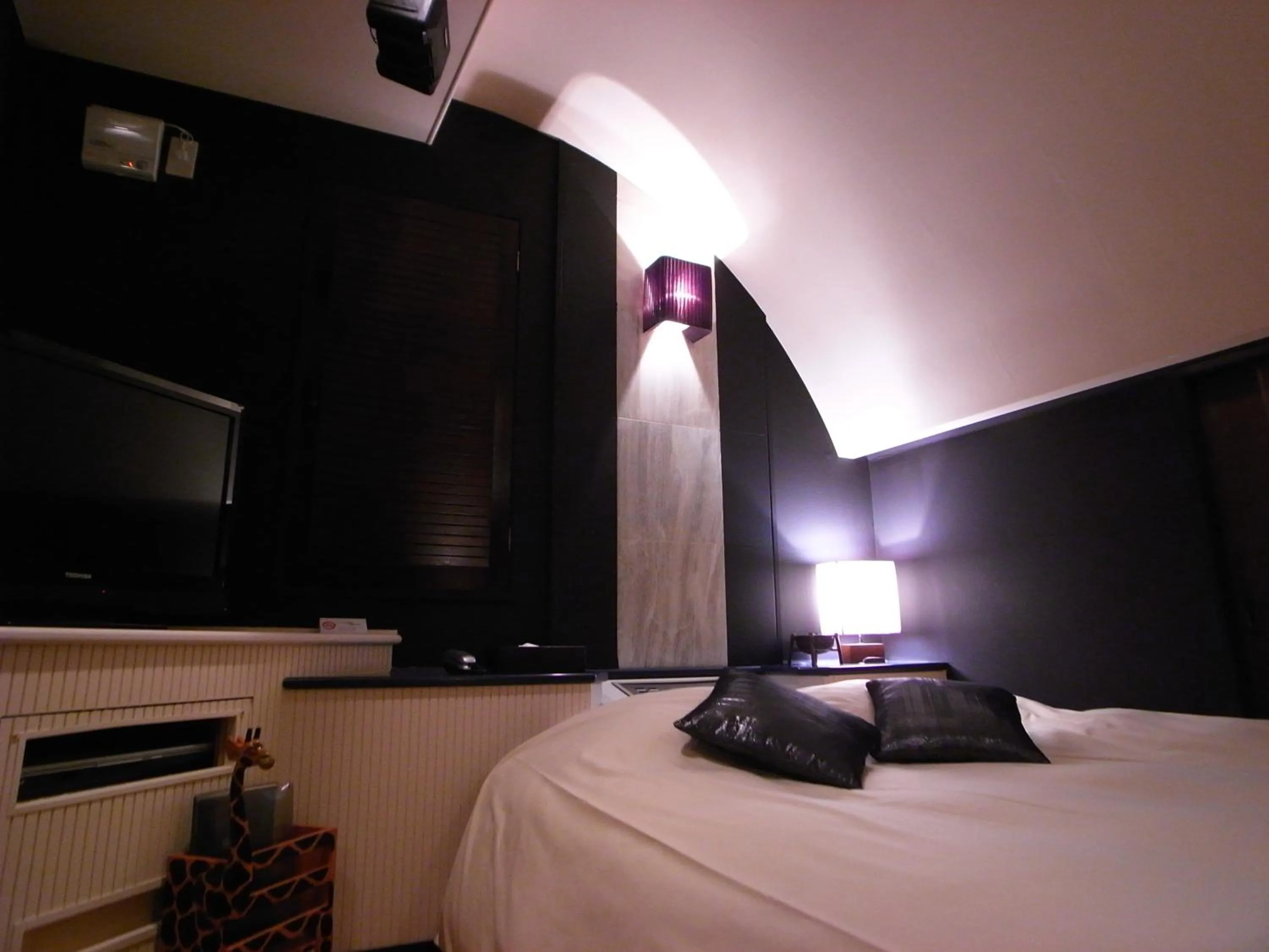 Bed in HOTEL CHECK INN BALI adult only