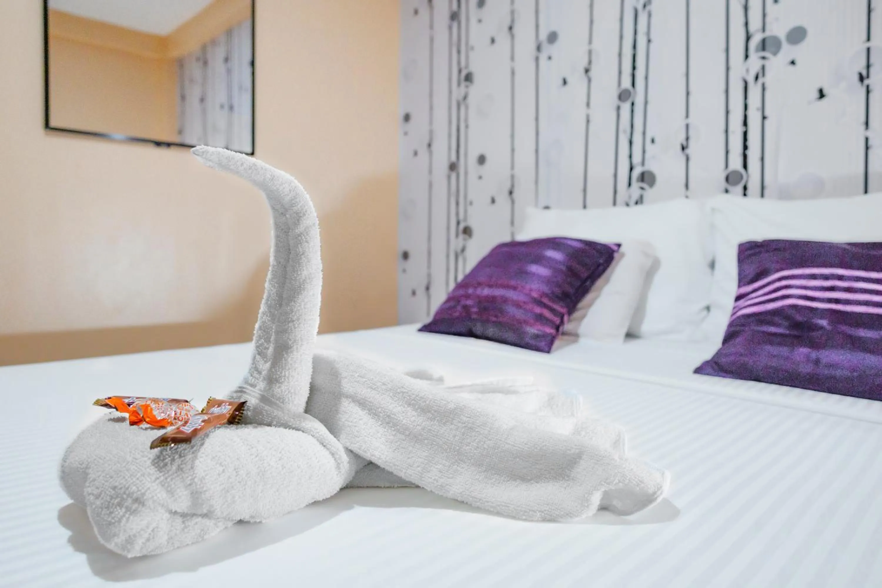 Bed in White Shamrock Beach Hotel