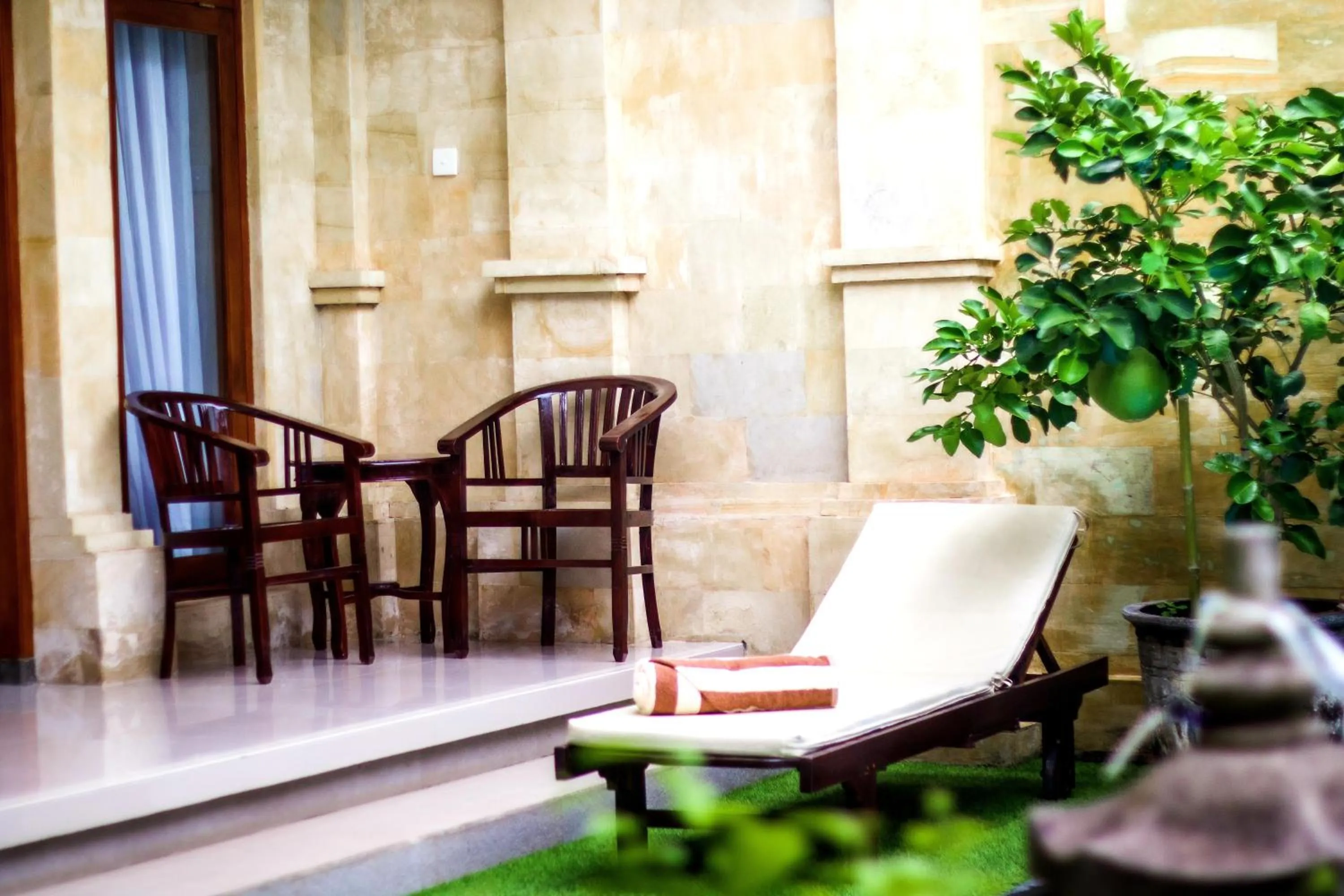 Seating area in Bali 85 Beach Inn