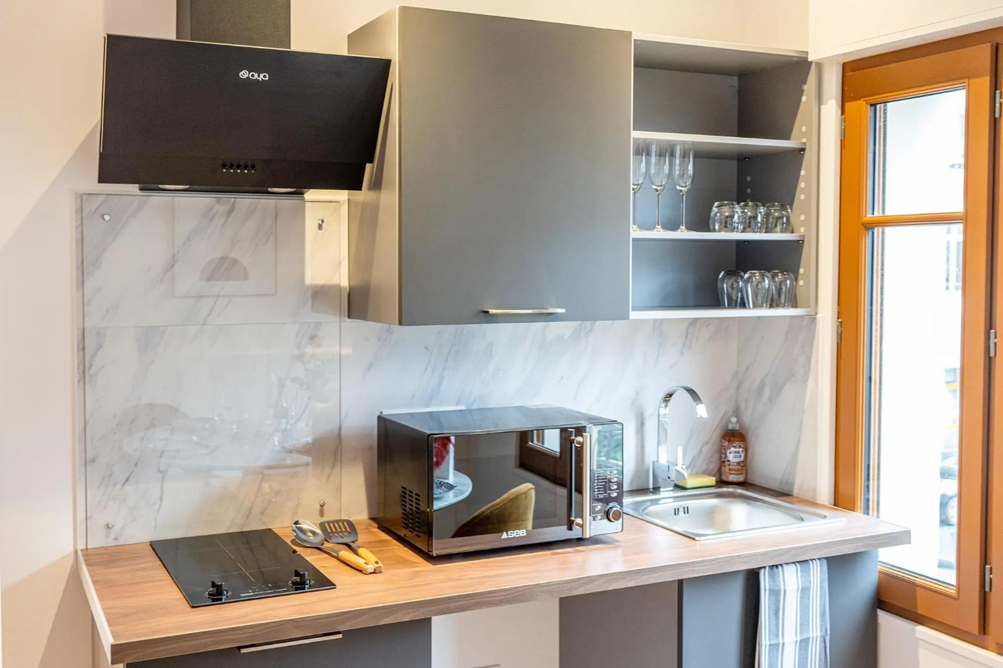 Kitchen or kitchenette in L'elegant - Appart'Hotel Le Gatsby