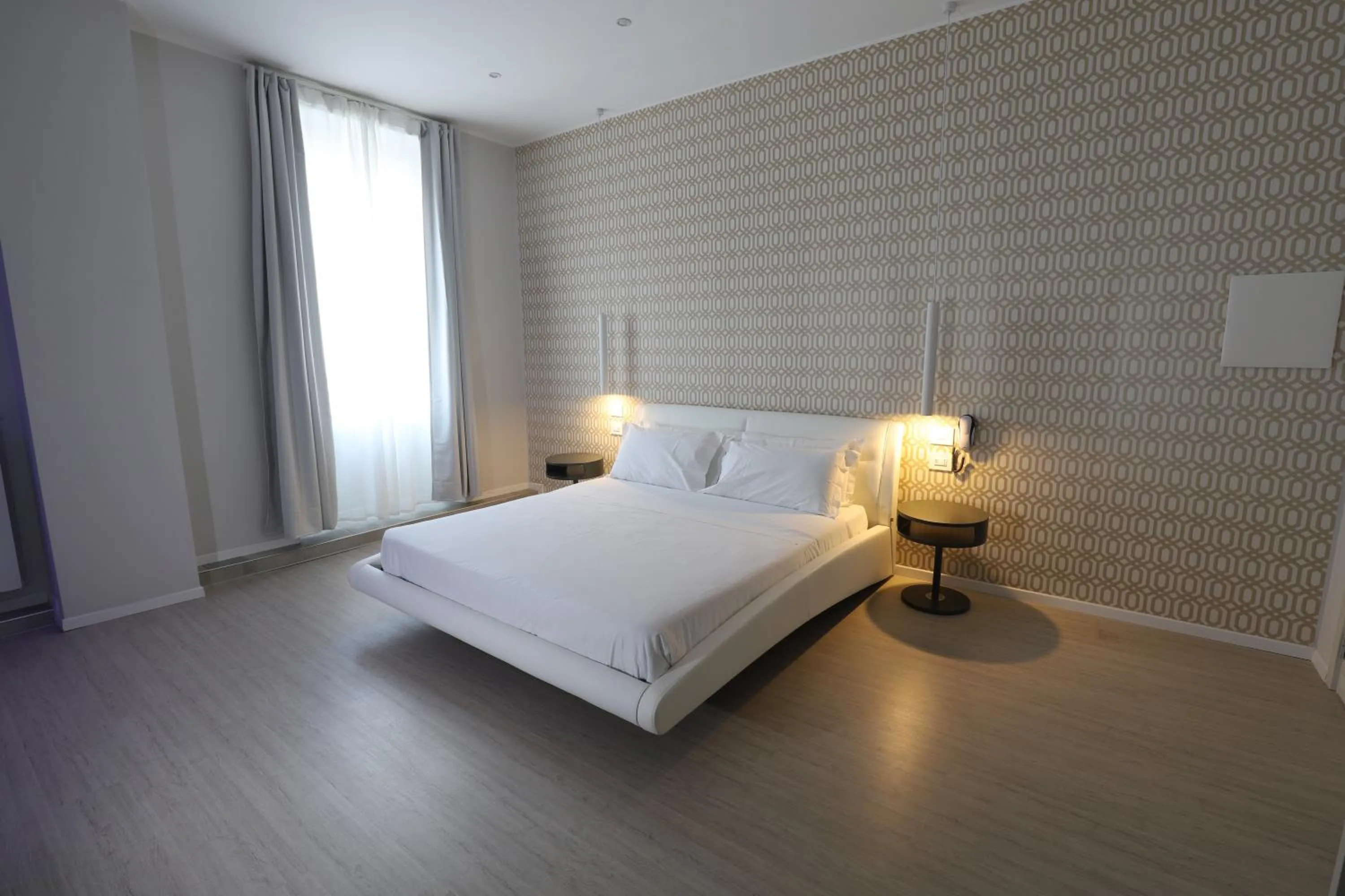 Bed in Cadorna Luxury Hotel