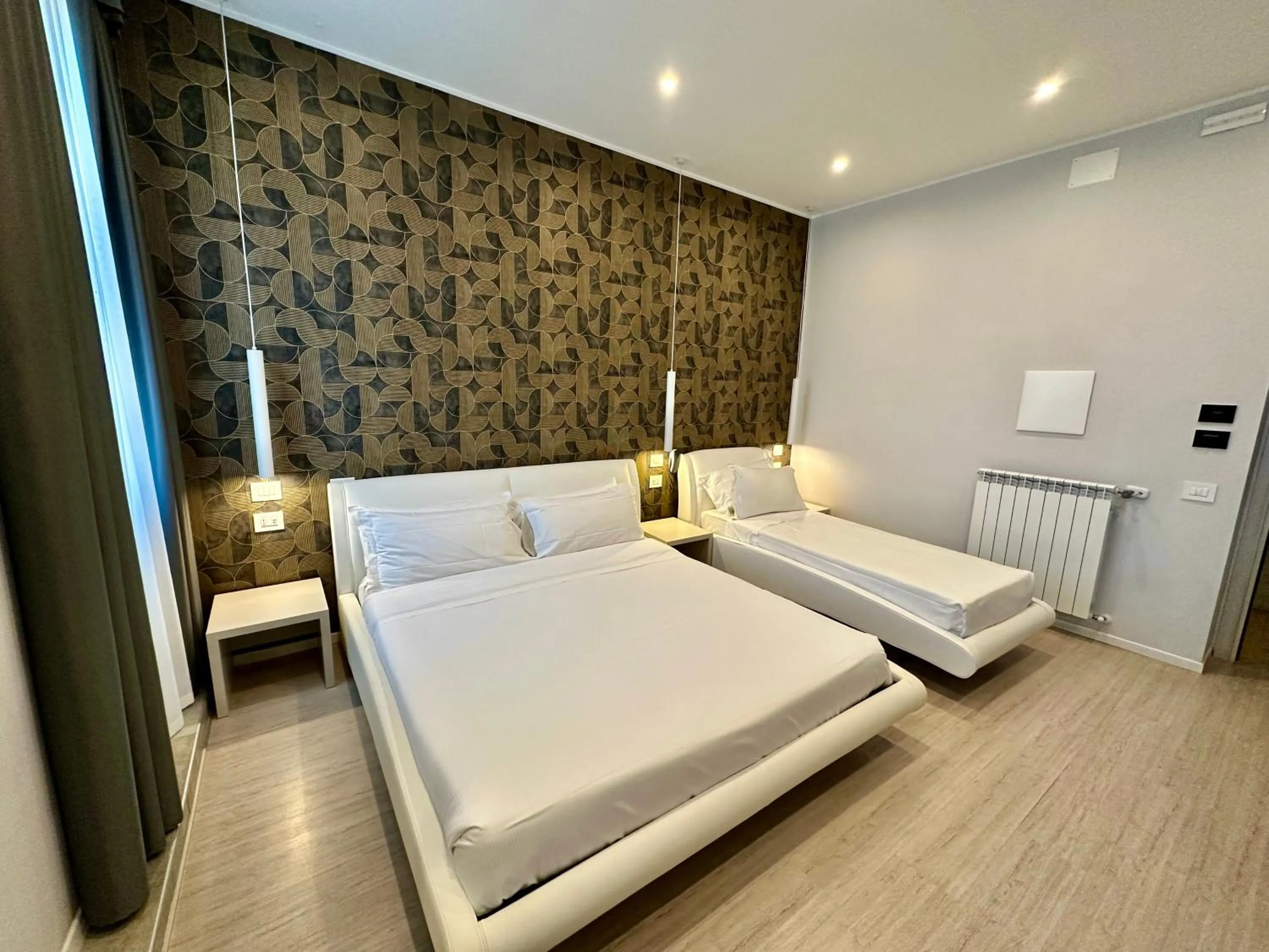 Bed in Cadorna Luxury Hotel