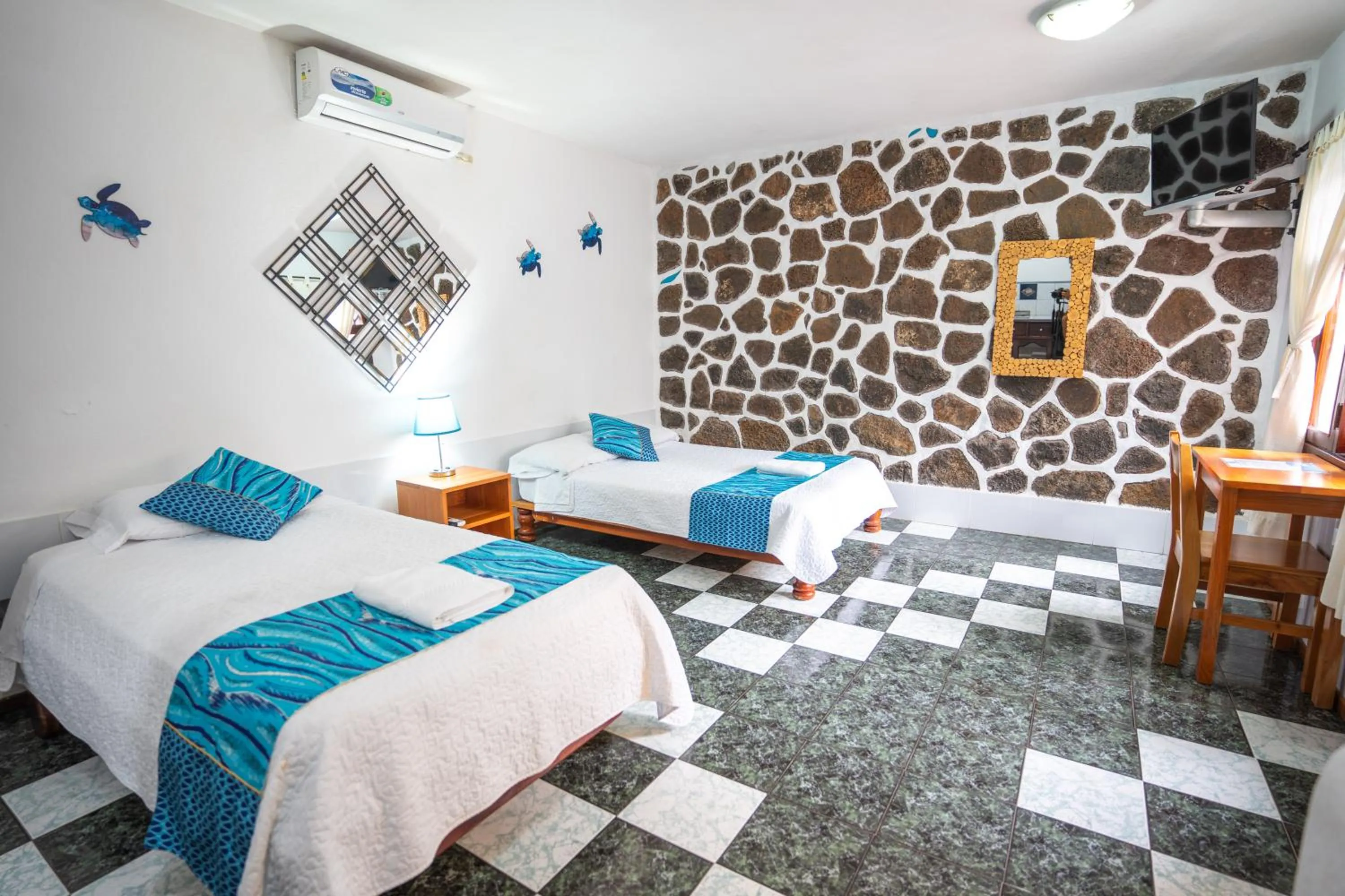 Seating area, Bed in Maidith Galapagos Inn