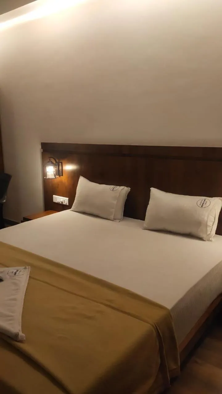 Bed in Hotel Anvisha Executive