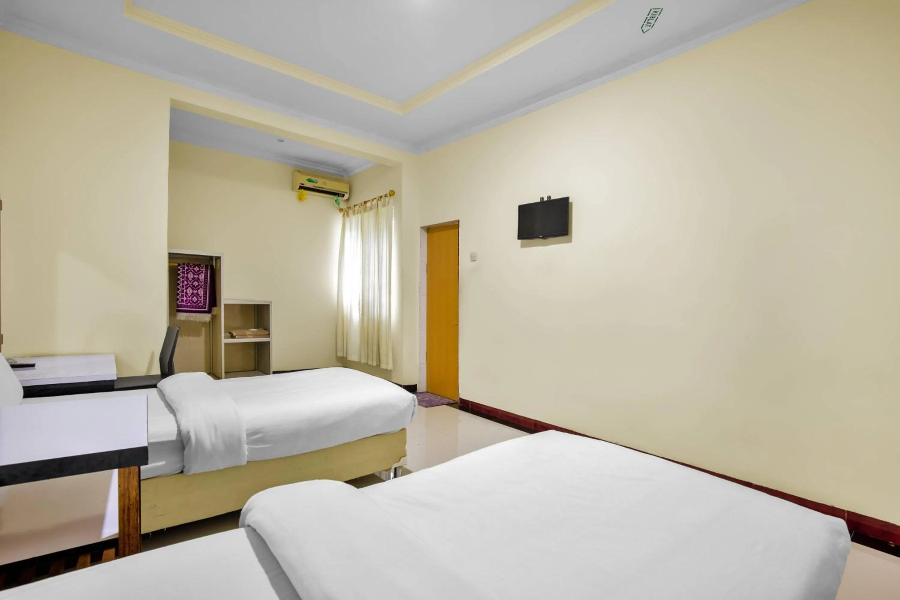 Bed in Malibou Hotel Medan