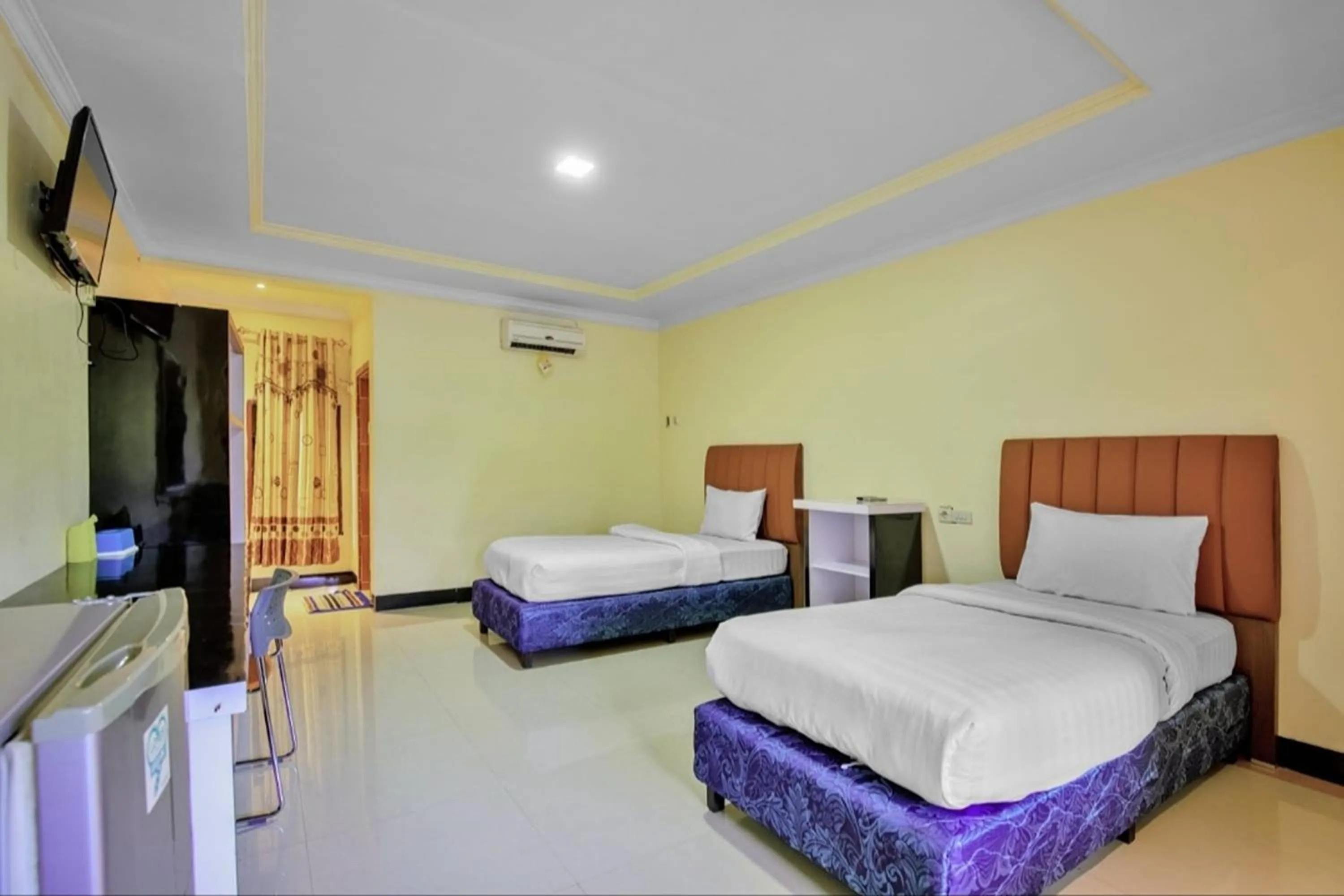 Bed in Malibou Hotel Medan
