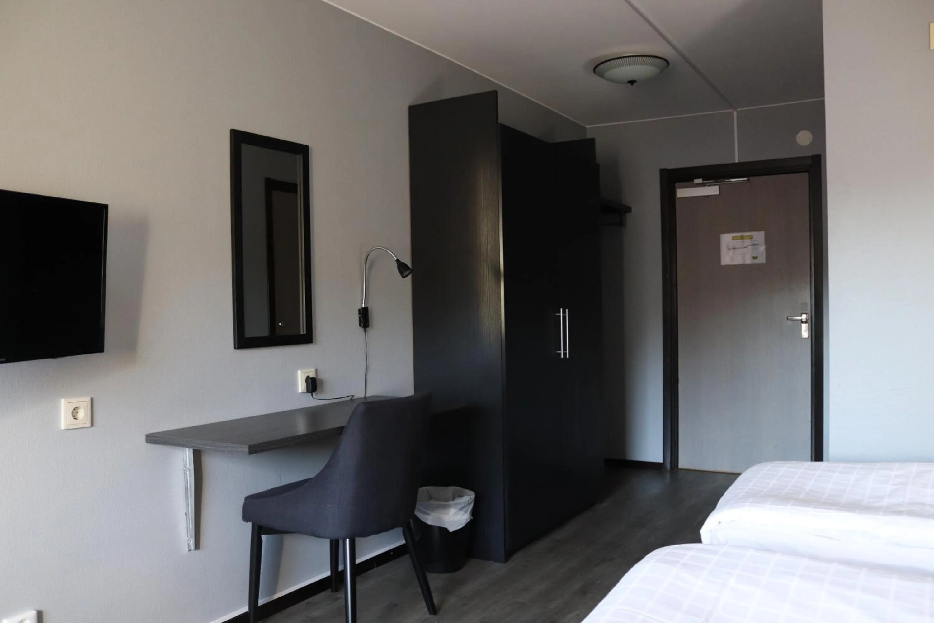 Seating area, Bed in Hotell Tjamstan Malå