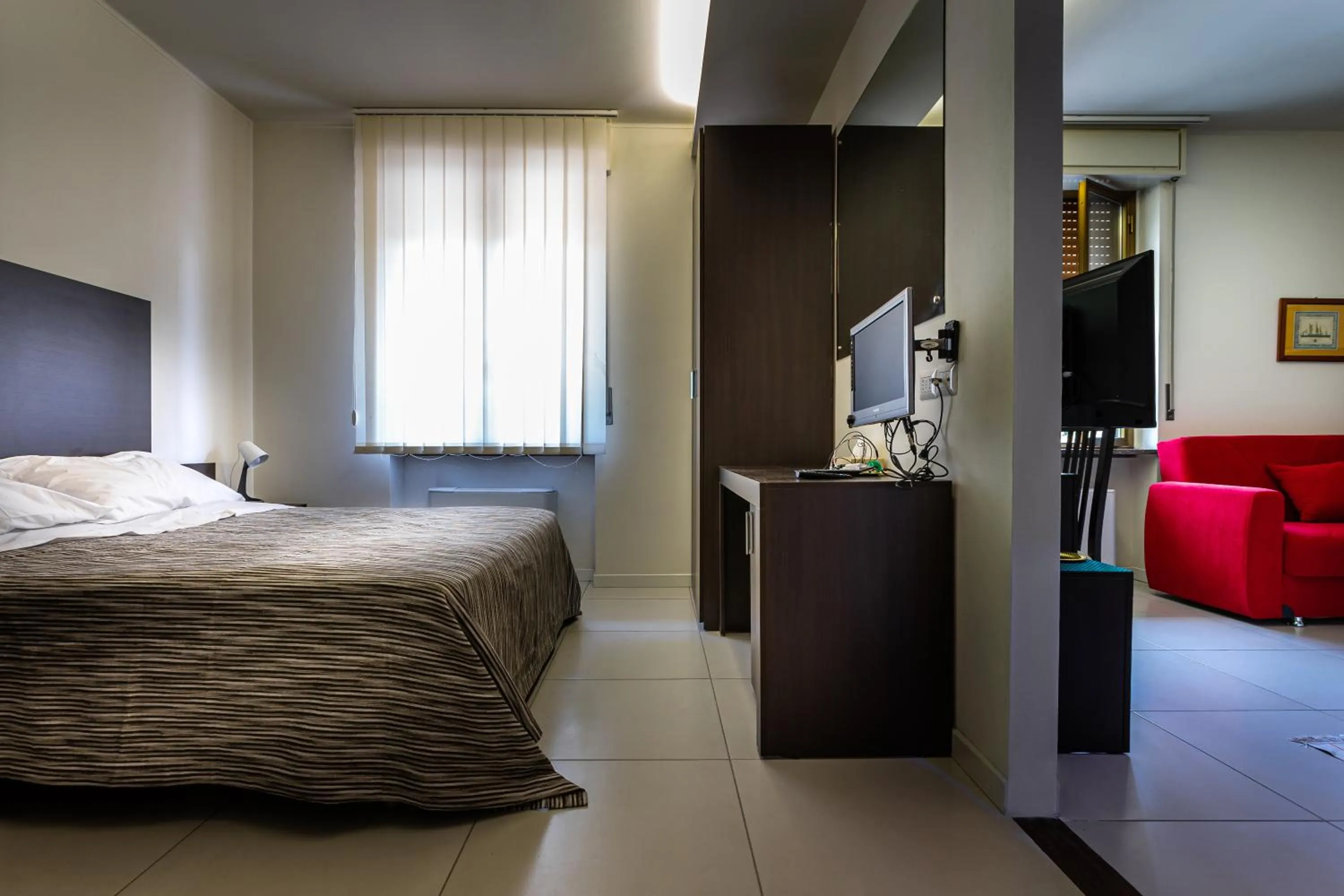 Photo of the whole room in Pasta Residence Italia Malpensa